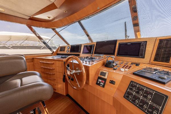 Luxurious helm station of 2001 Grand Harbour 76 yacht with advanced navigation systems.