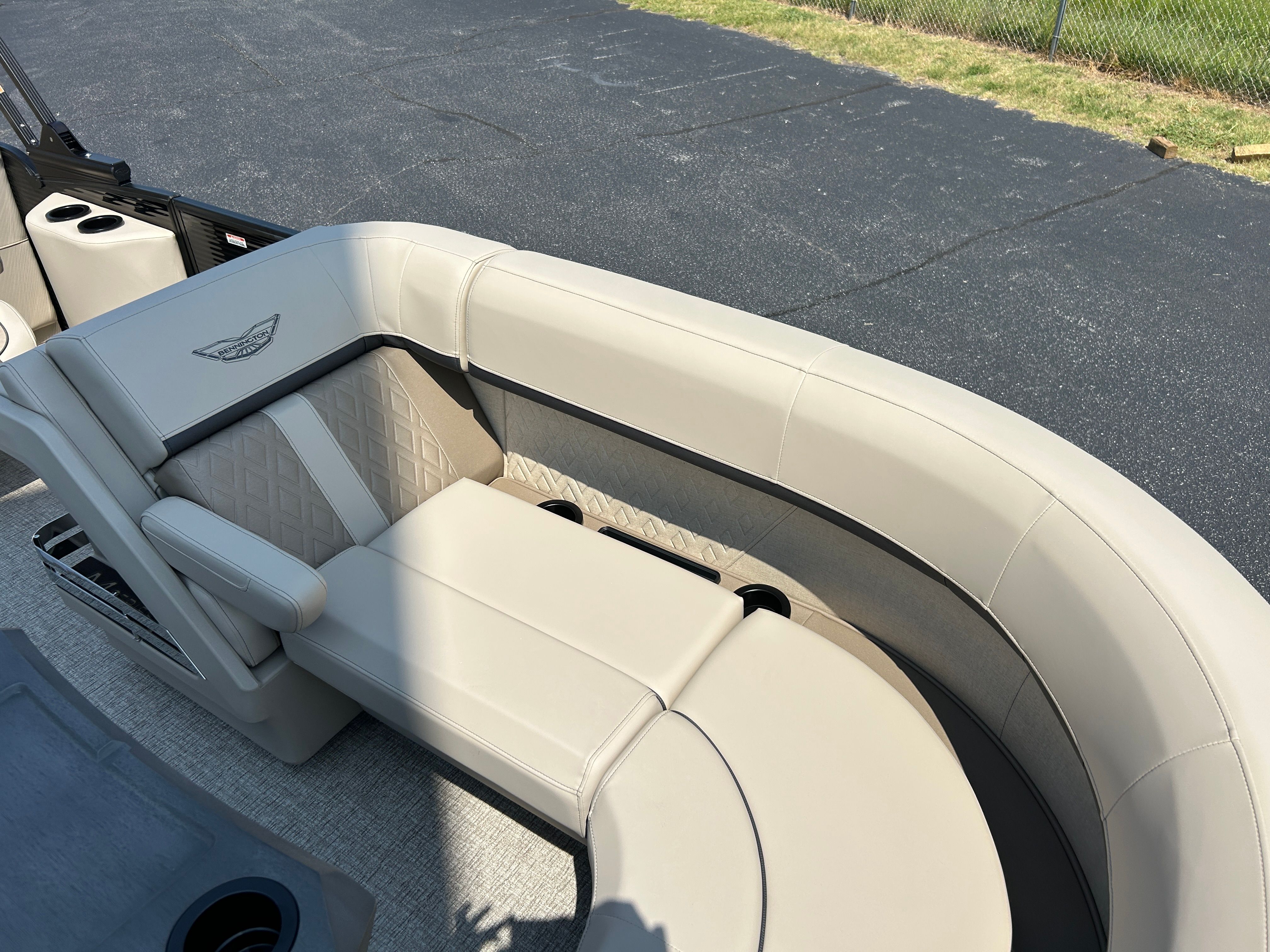 The image shows the beige leather seating inside a 2026 Bennington 22 MFB boat.