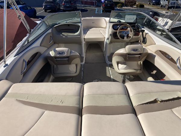 2008 Chaparral 210 SSi boat interior with beige seating and steering console.
