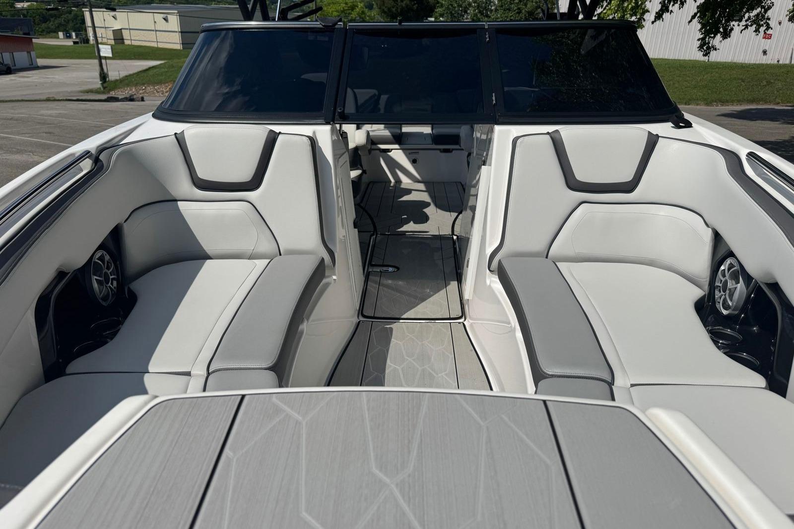 2023 Yamaha Boats 252XE interior with sleek white seating and modern design.