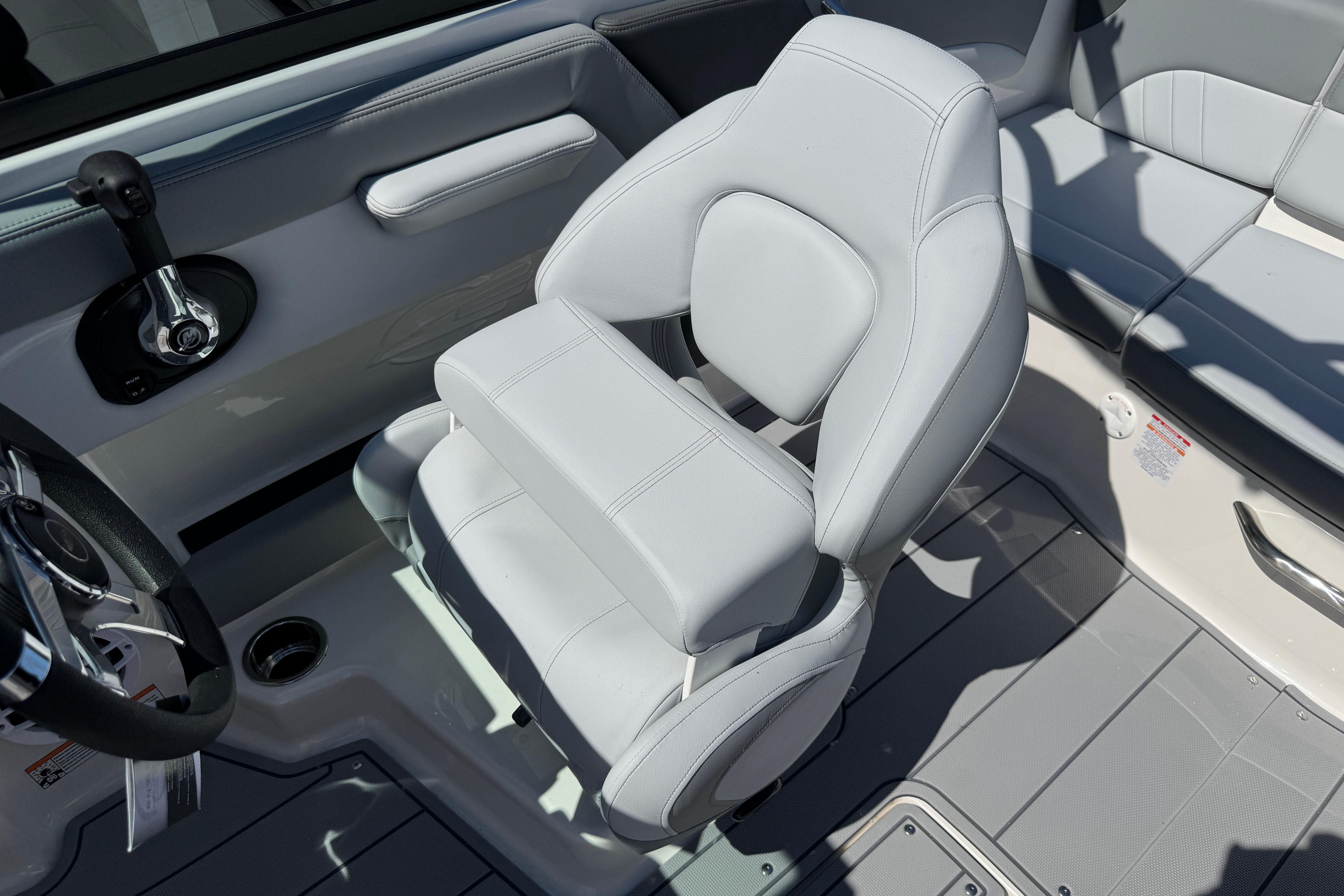 2026 Chaparral 21 SSi boat interior with sleek, modern seating and steering wheel.