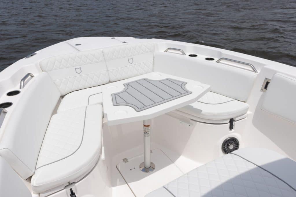 Luxurious seating area on 2027 Sea Fox 268 Commander boat with elegant white upholstery.