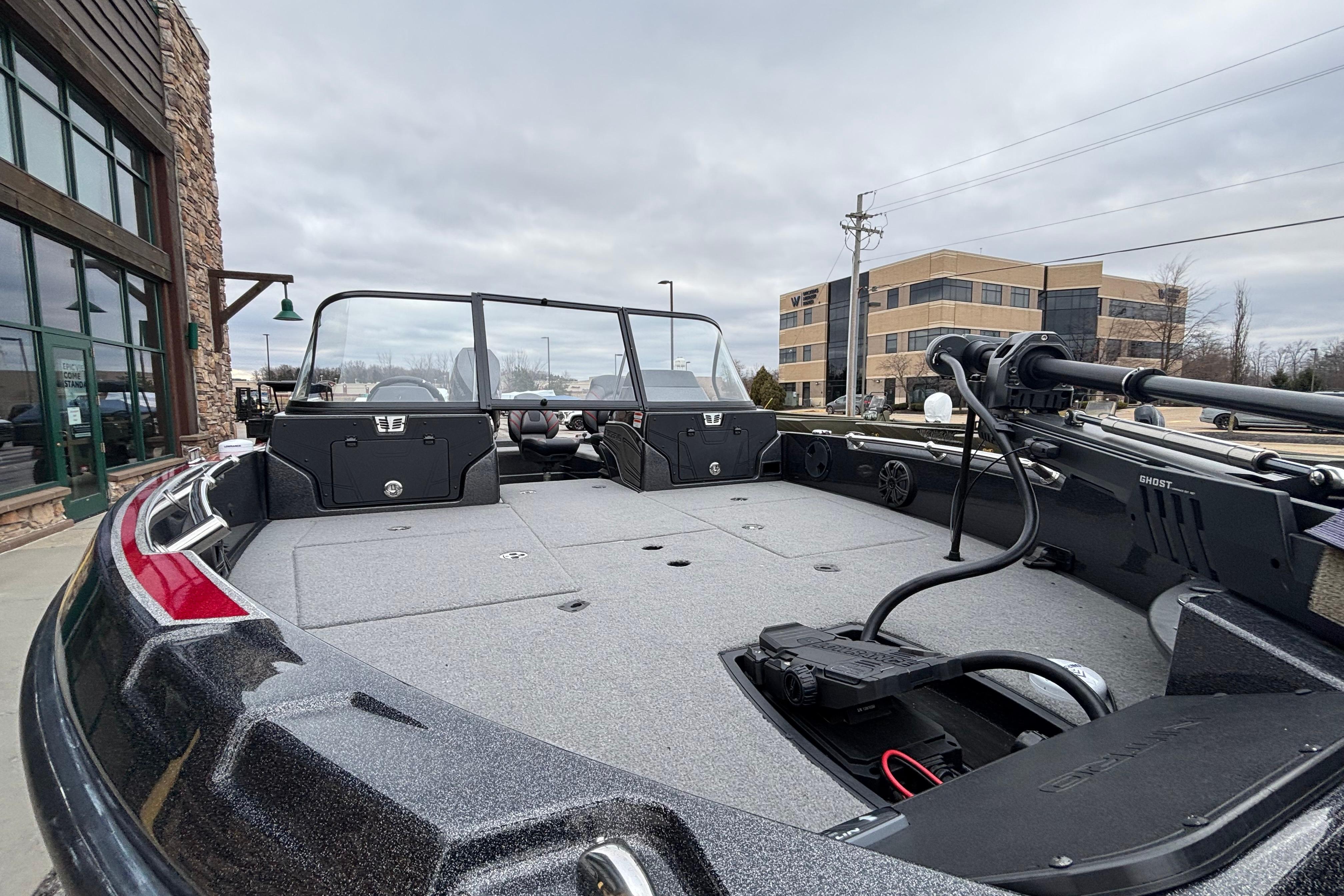 2024 Nitro ZV21 Pro boat with spacious deck and advanced equipment, parked outdoors.