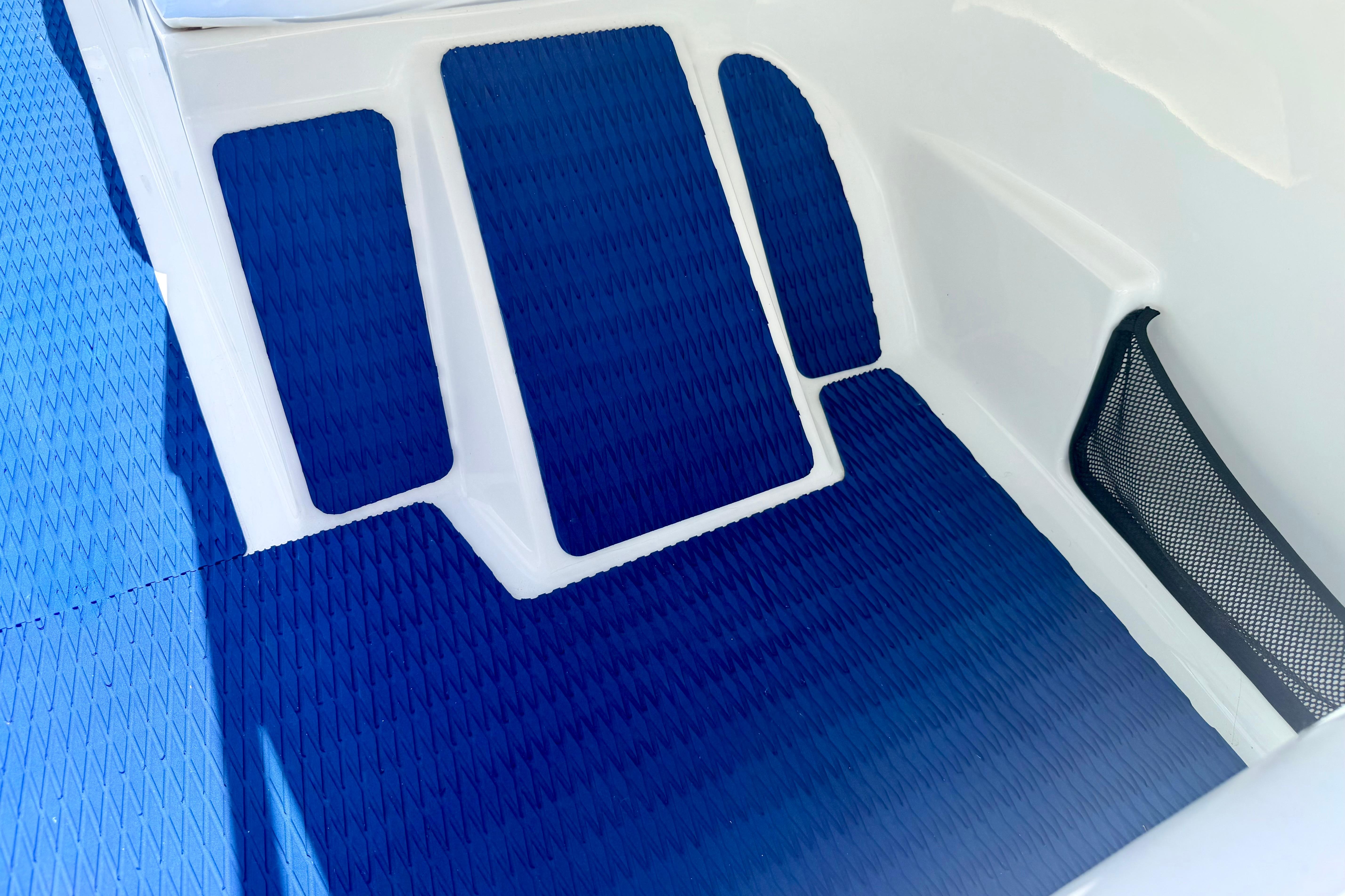 Interior view of a 2004 Bombardier SEADOO Utopia 185 with blue non-slip flooring.