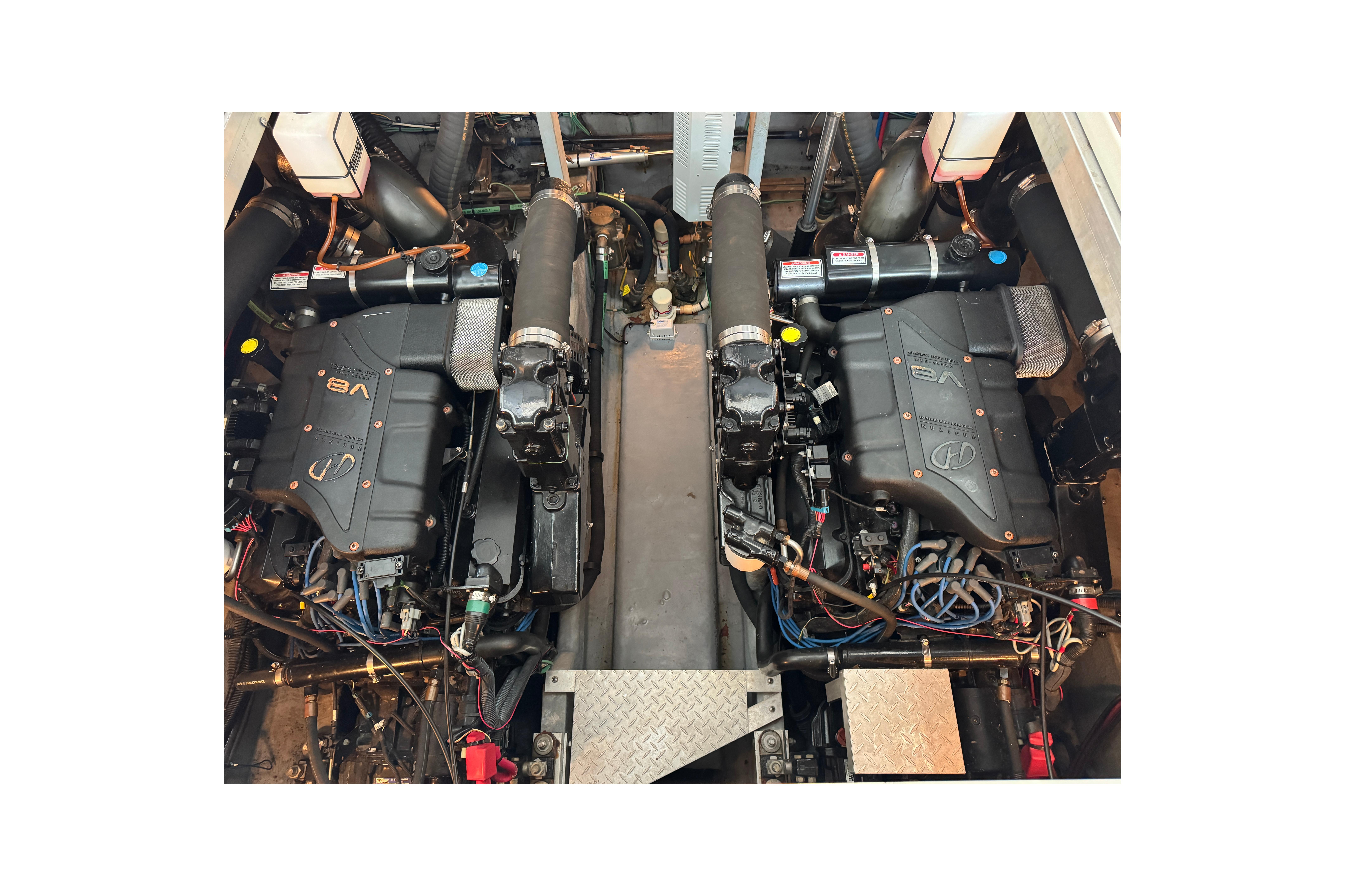 Engine room of a 2001 Sea Ray 380 Sundancer with dual V8 engines.