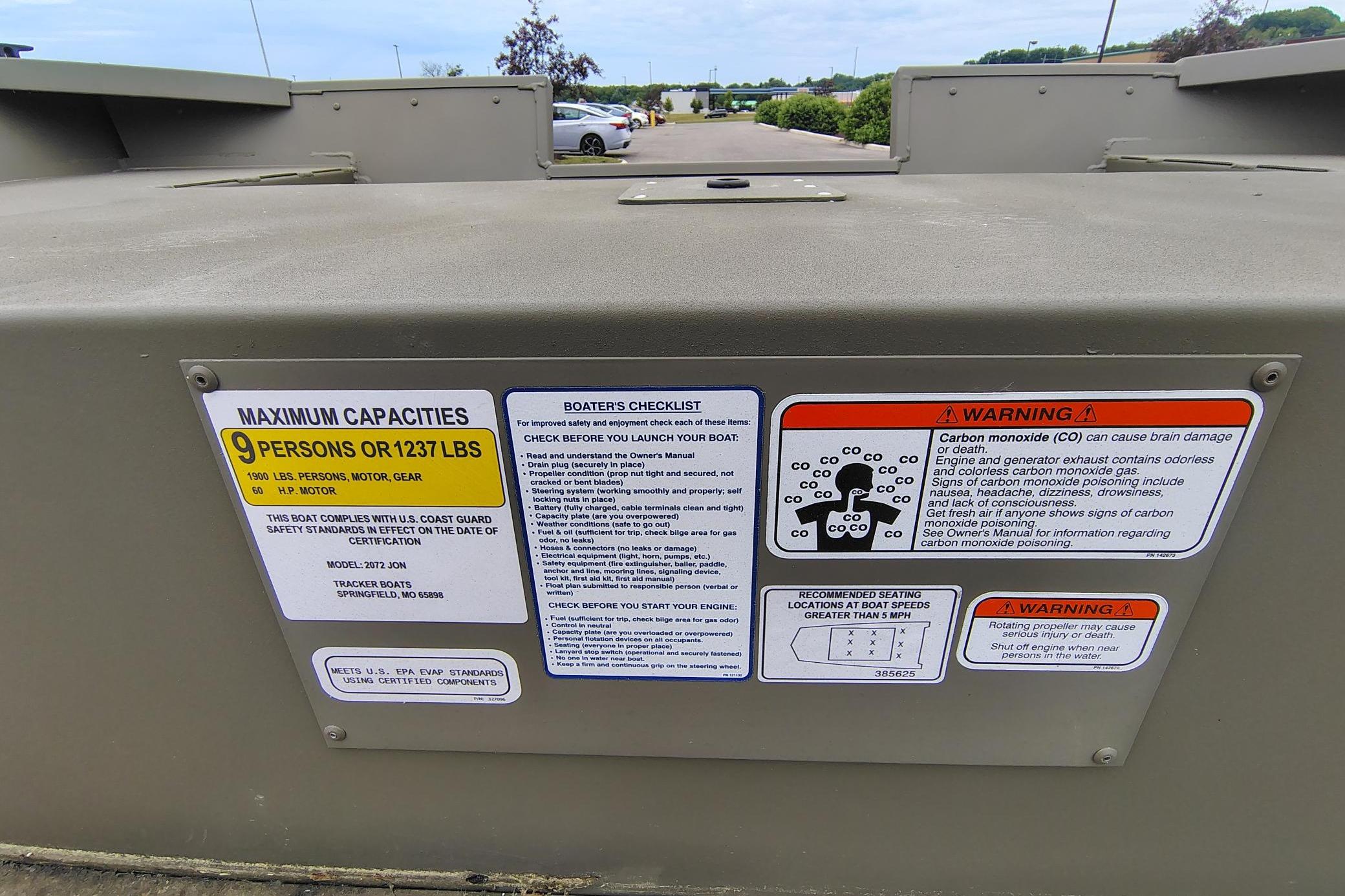 2026 Tracker Grizzly 2072 Utility boat capacity and safety warning labels.