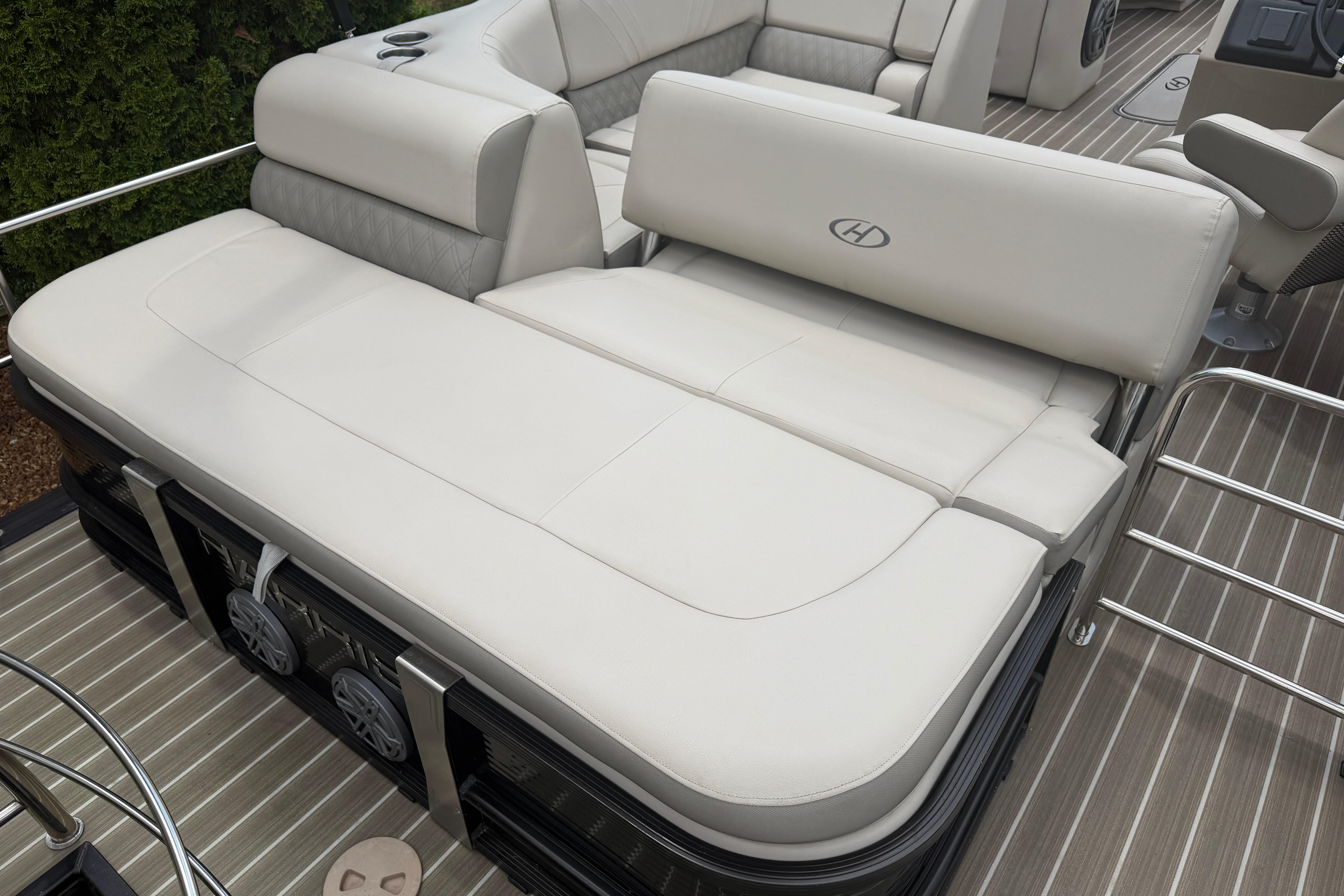 2019 Harris Solstice 240 boat interior with luxurious beige seating and sleek design.