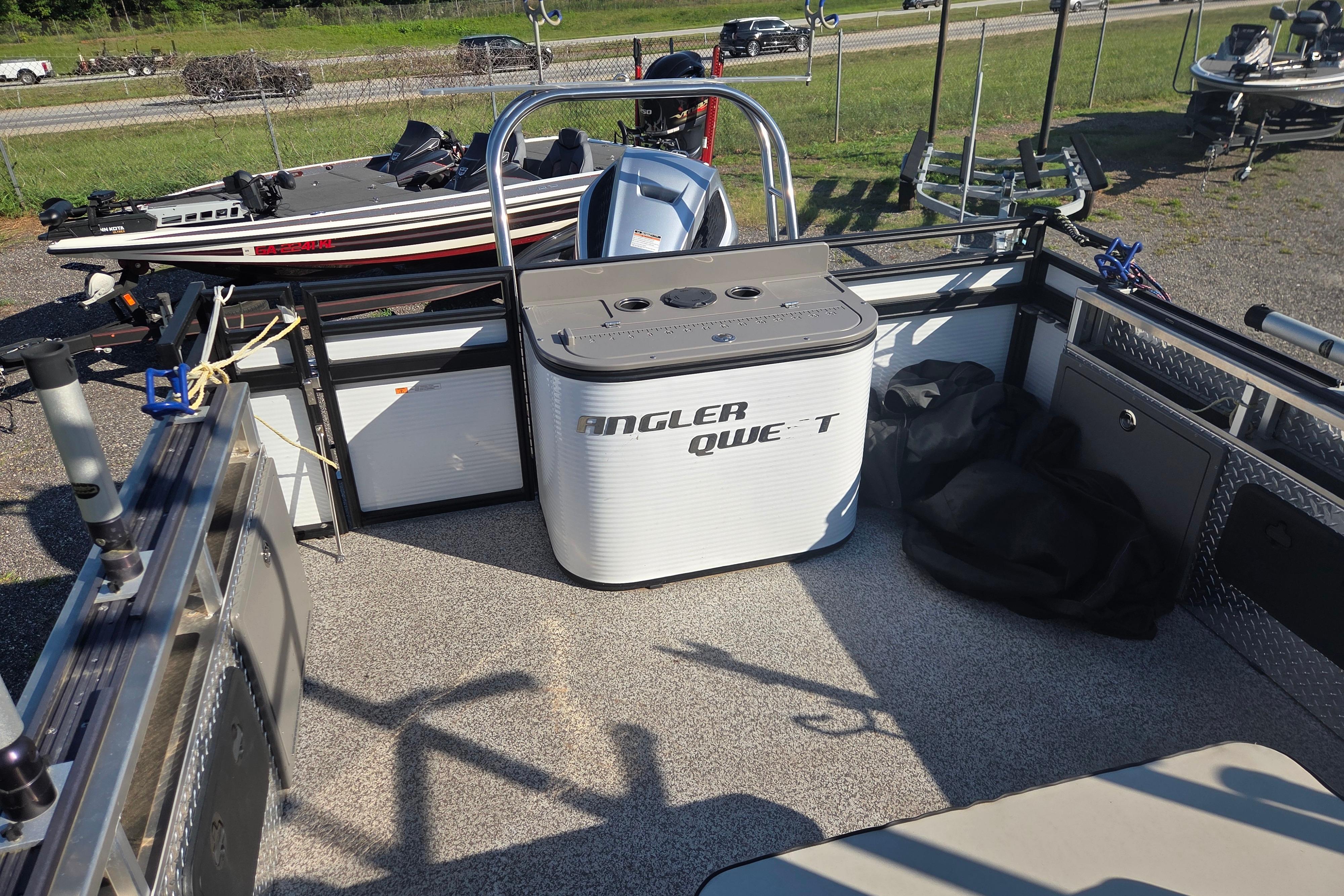 2024 Angler Qwest 8526 Pro Troll boat interior with fishing equipment and storage.
