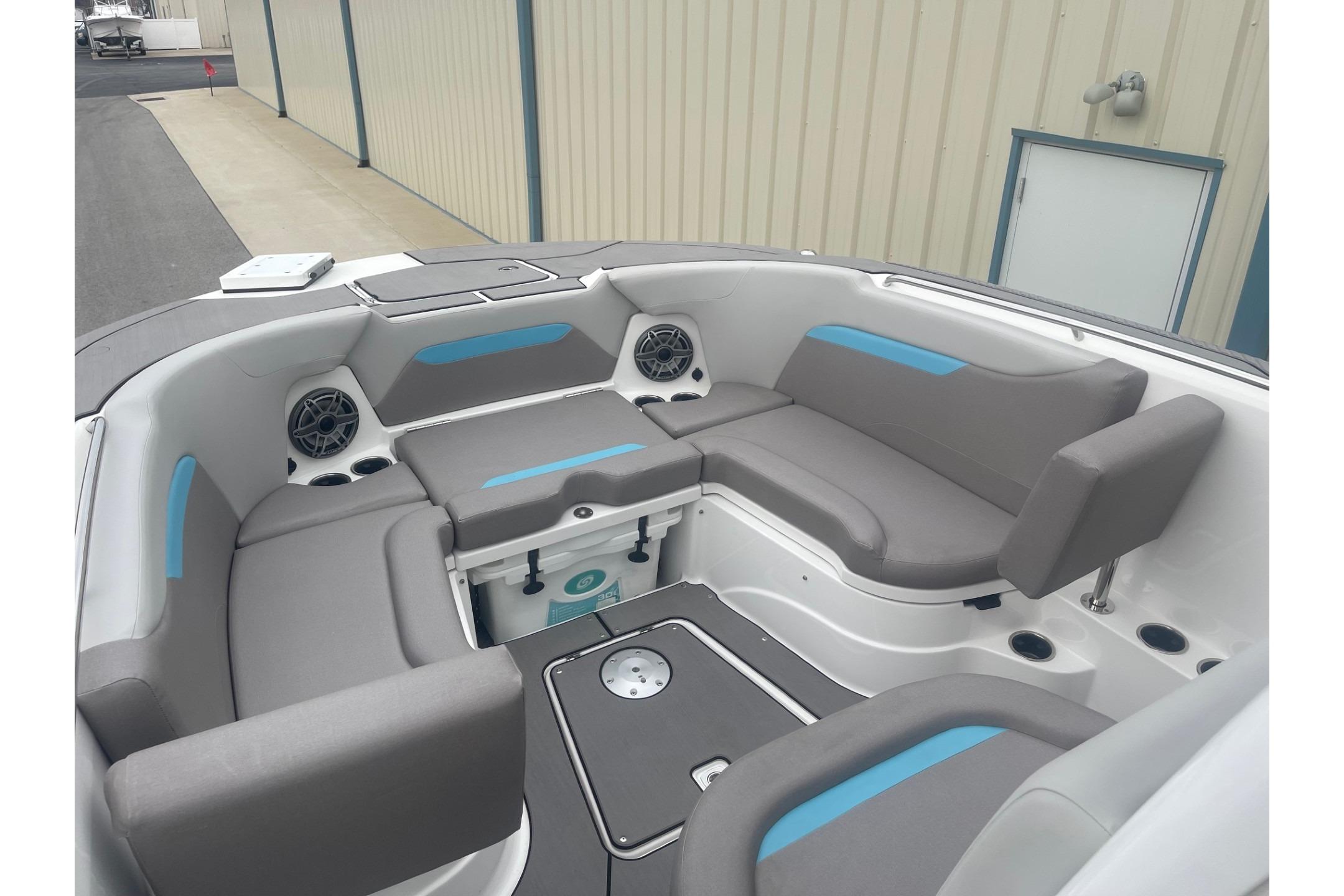 2025 Hurricane Center Console 24 OB boat interior with gray seating and built-in speakers.