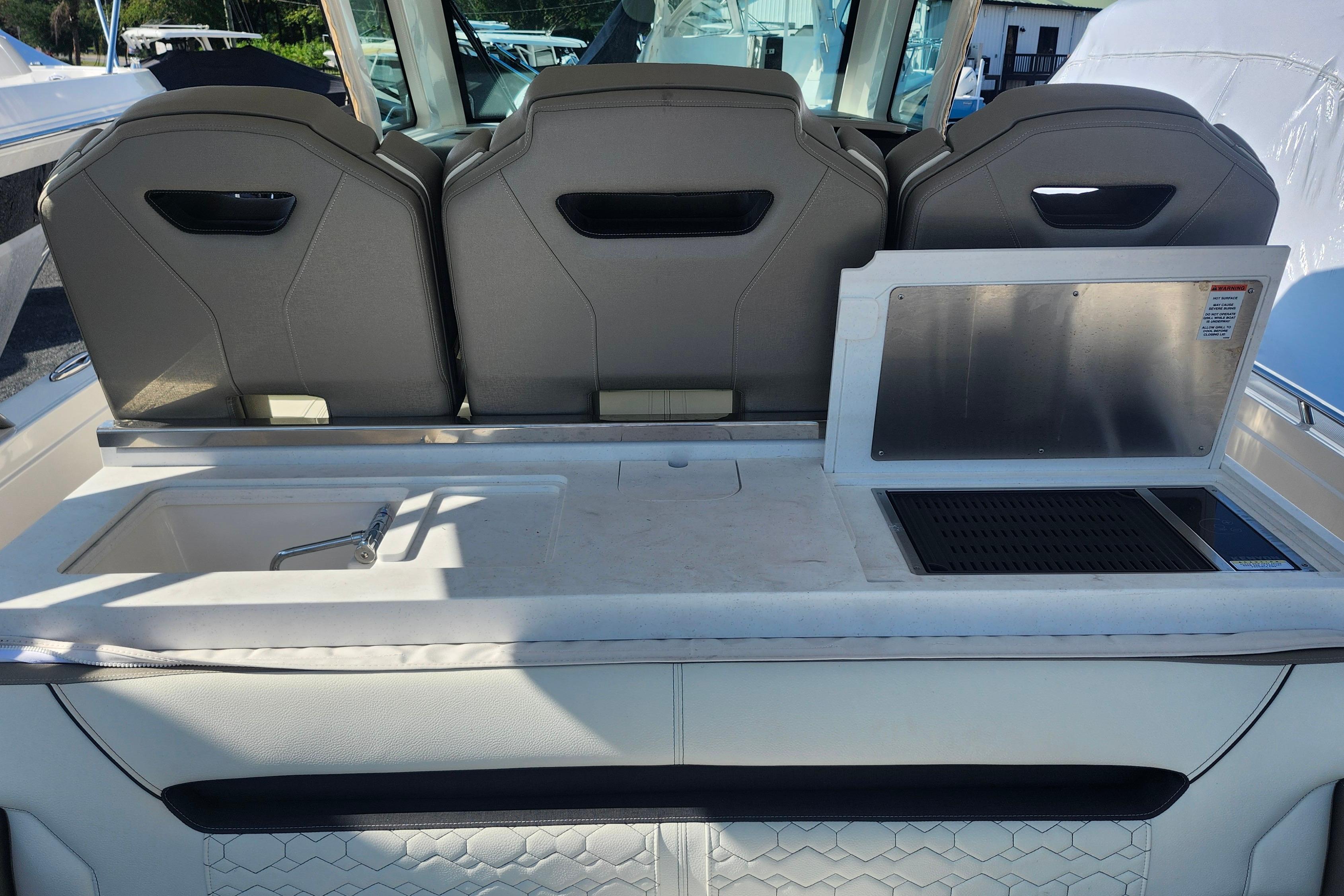 2024 Tiara Yachts 34 LS interior with seating and kitchenette area.