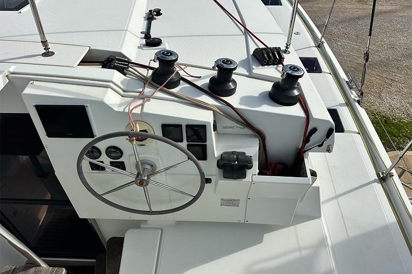 Helm station of 2018 Fountaine Pajot Lucia 40 catamaran with steering wheel and winches.