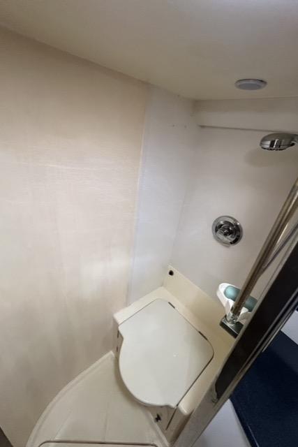 Bathroom interior of 1994 Sunseeker Camargue 55 yacht, featuring compact design and modern fixtures.