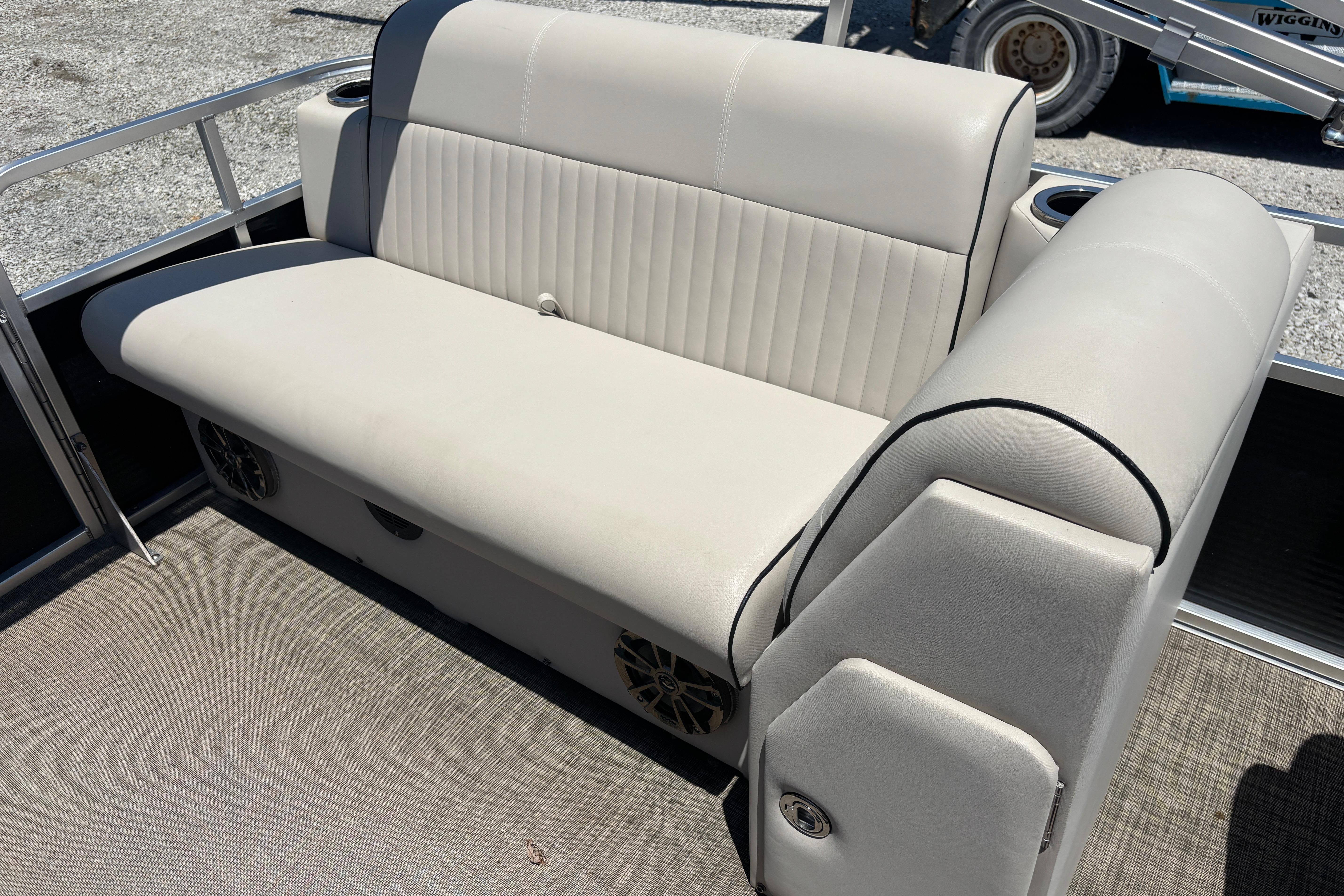 2017 Qwest LS 822 Bar boat seat with beige upholstery and cup holders.