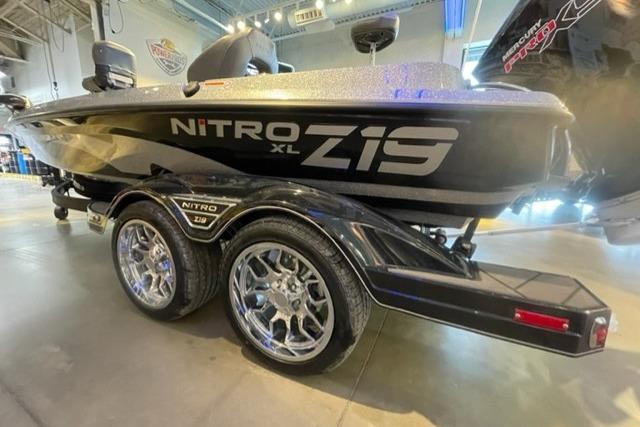 2026 Nitro Z19 XL Pro boat with sleek design and shiny chrome wheels.