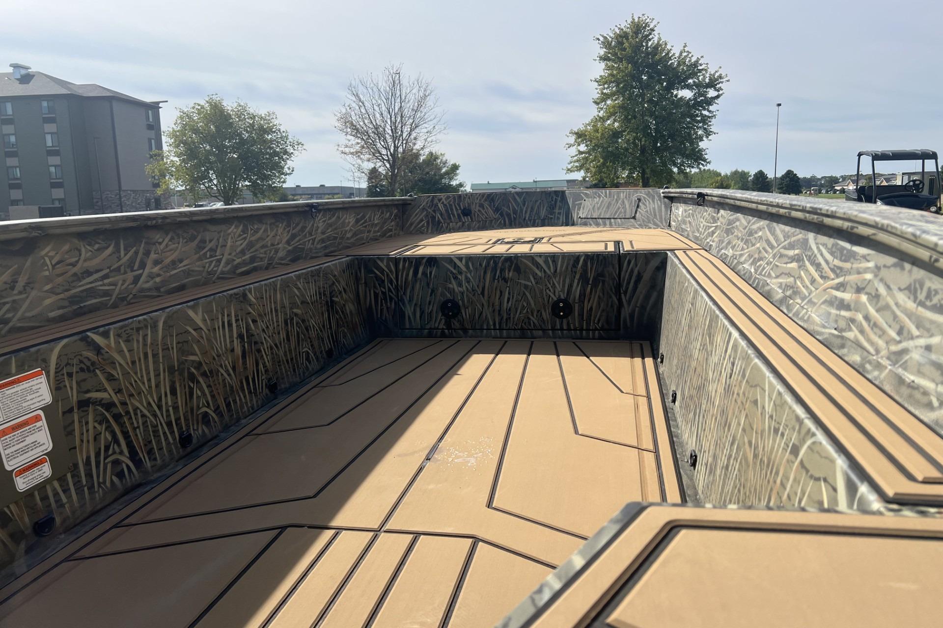 2026 Tracker Grizzly 1650 T Prairie Wings Edition boat interior with camouflage design.