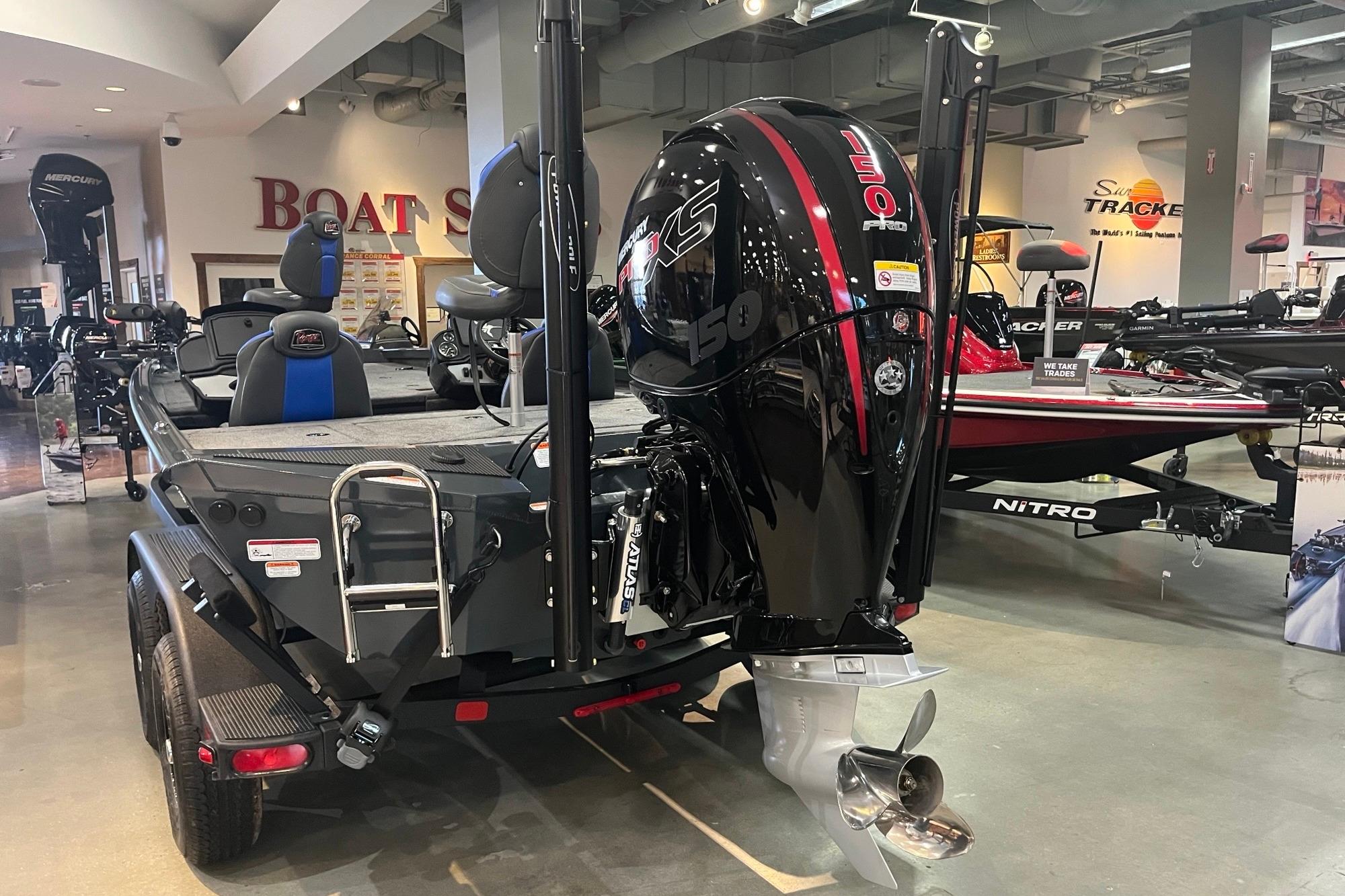 2026 Ranger RT198P boat with powerful outboard motor displayed in showroom.