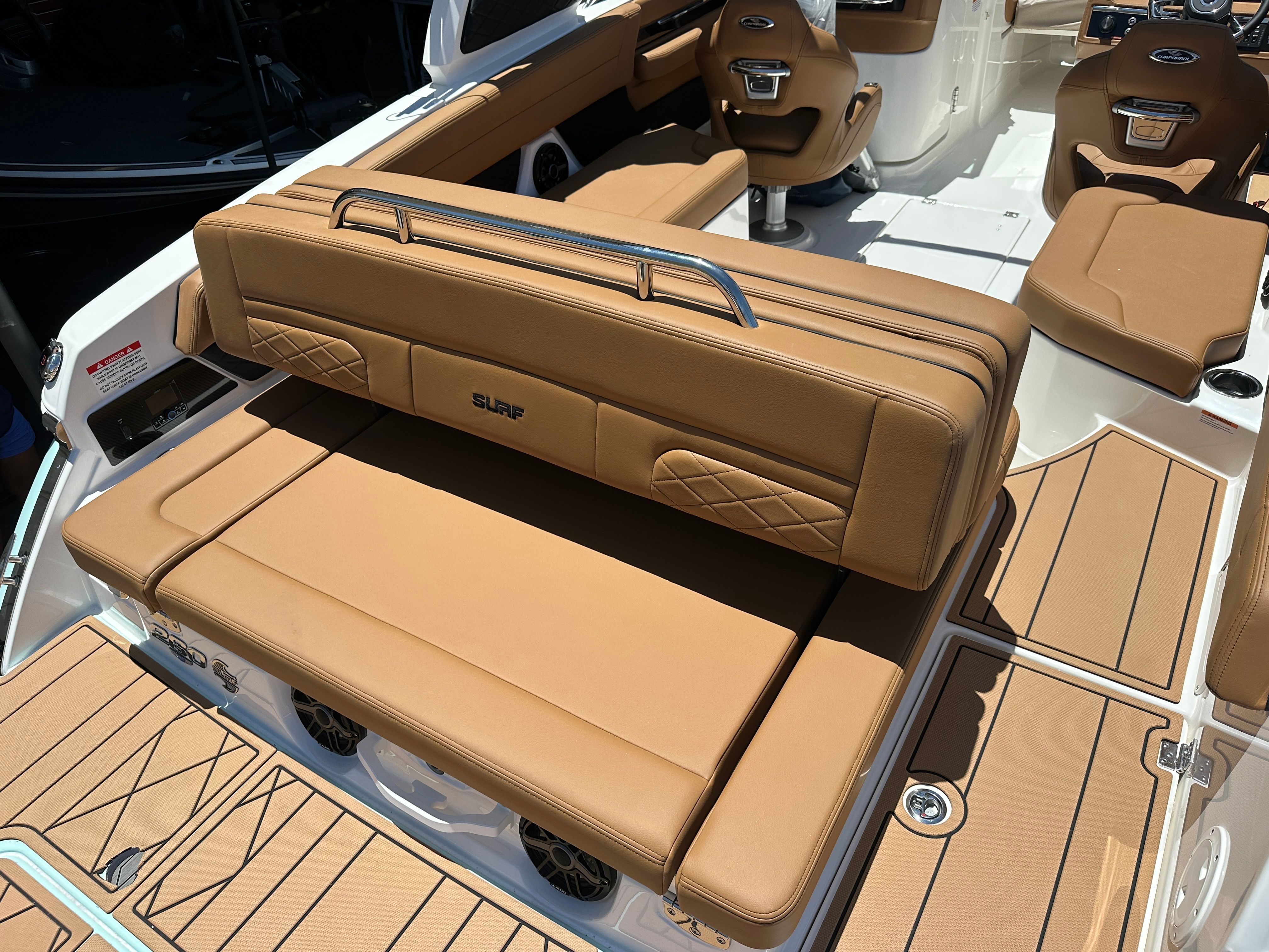 The image shows the cockpit of a Chaparral 26 Surf boat with brown upholstery.