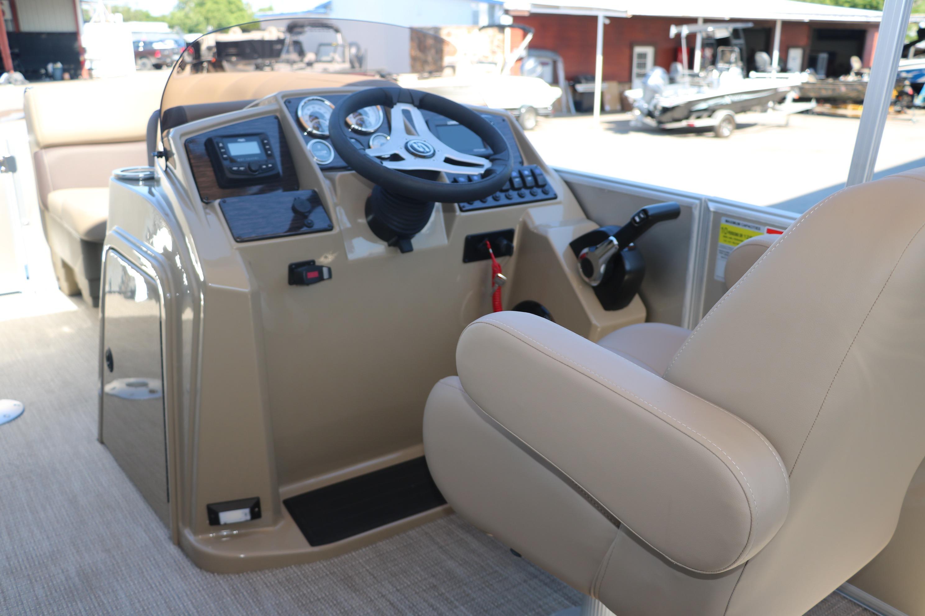 2025 Sylvan Mirage 820 CLZ DH boat helm with steering wheel and controls.