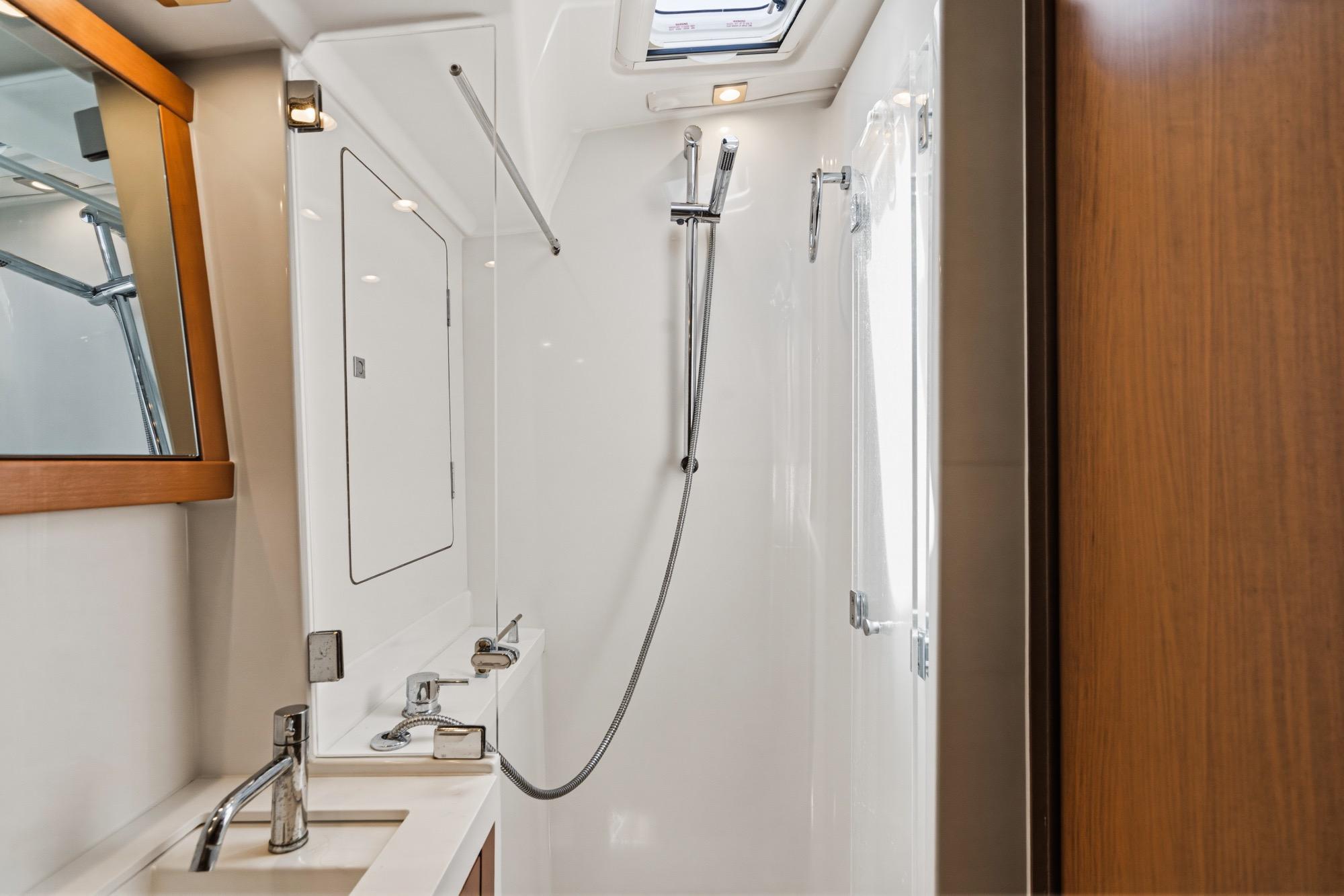 Luxurious bathroom interior of 2017 Beneteau Sense 50 yacht with modern fixtures.