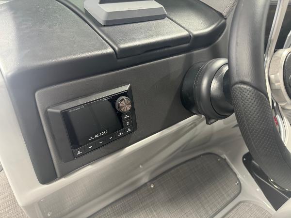 2025 Manitou LX dashboard with JL Audio system and steering wheel detail.