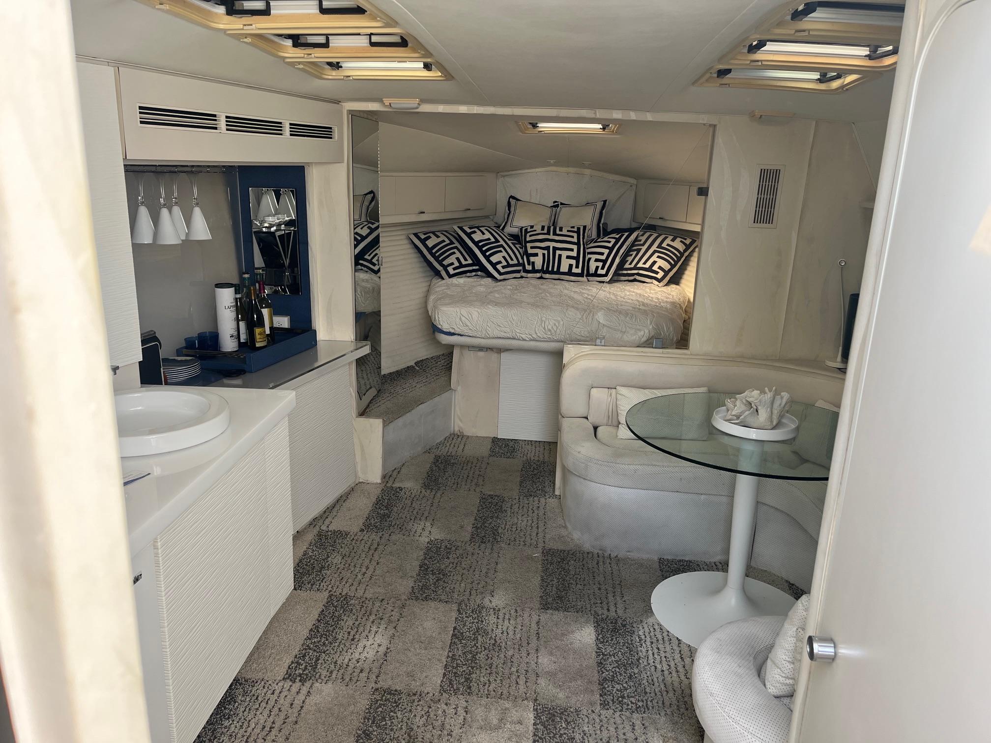 Interior of a 1993 Silverton 38 Express yacht with modern decor and cozy seating area.