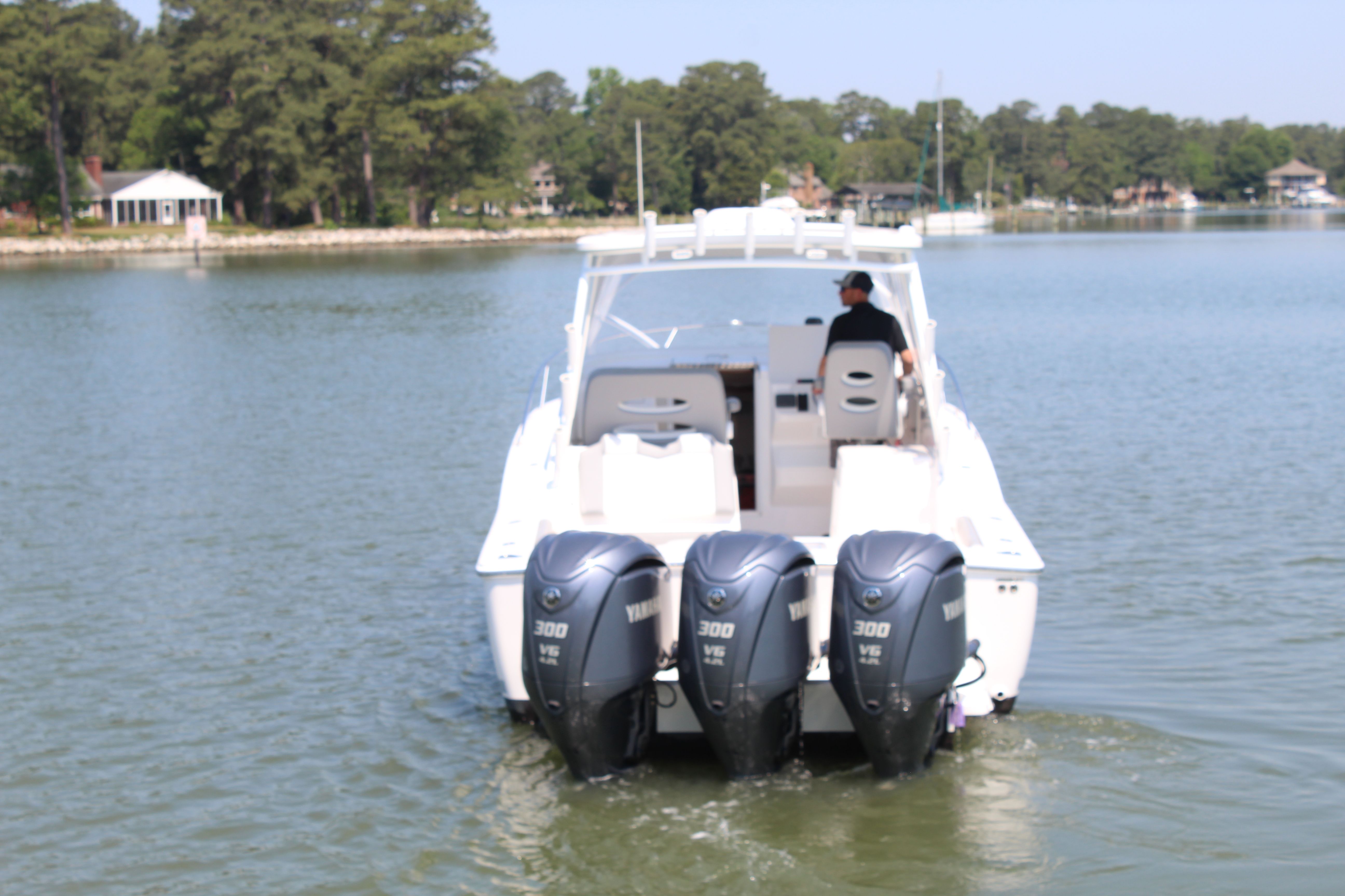 2024 Albemarle 30 Express boat with triple outboard engines.