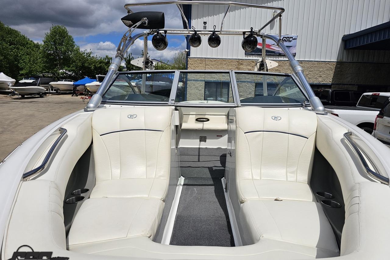 2010 Cobalt 232 WSS boat interior with white seating and wakeboard tower.