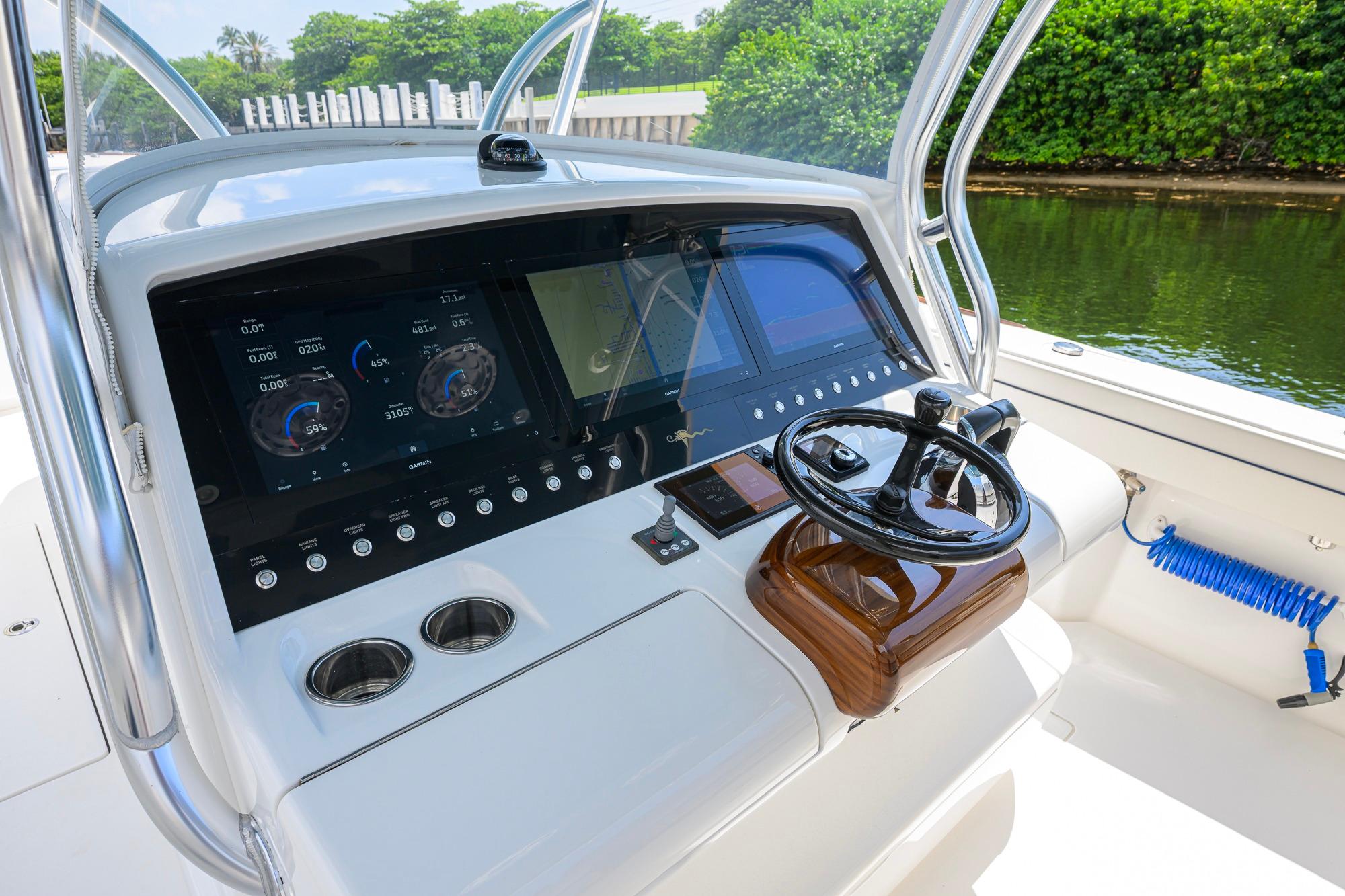 2020 Valhalla Boatworks V-41 helm with advanced navigation displays and steering wheel.