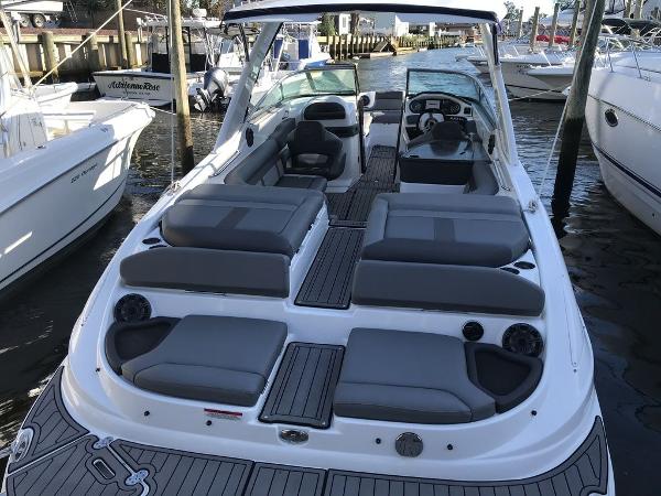 2020 Rinker 29QX BR boat with spacious seating and modern design docked at marina.