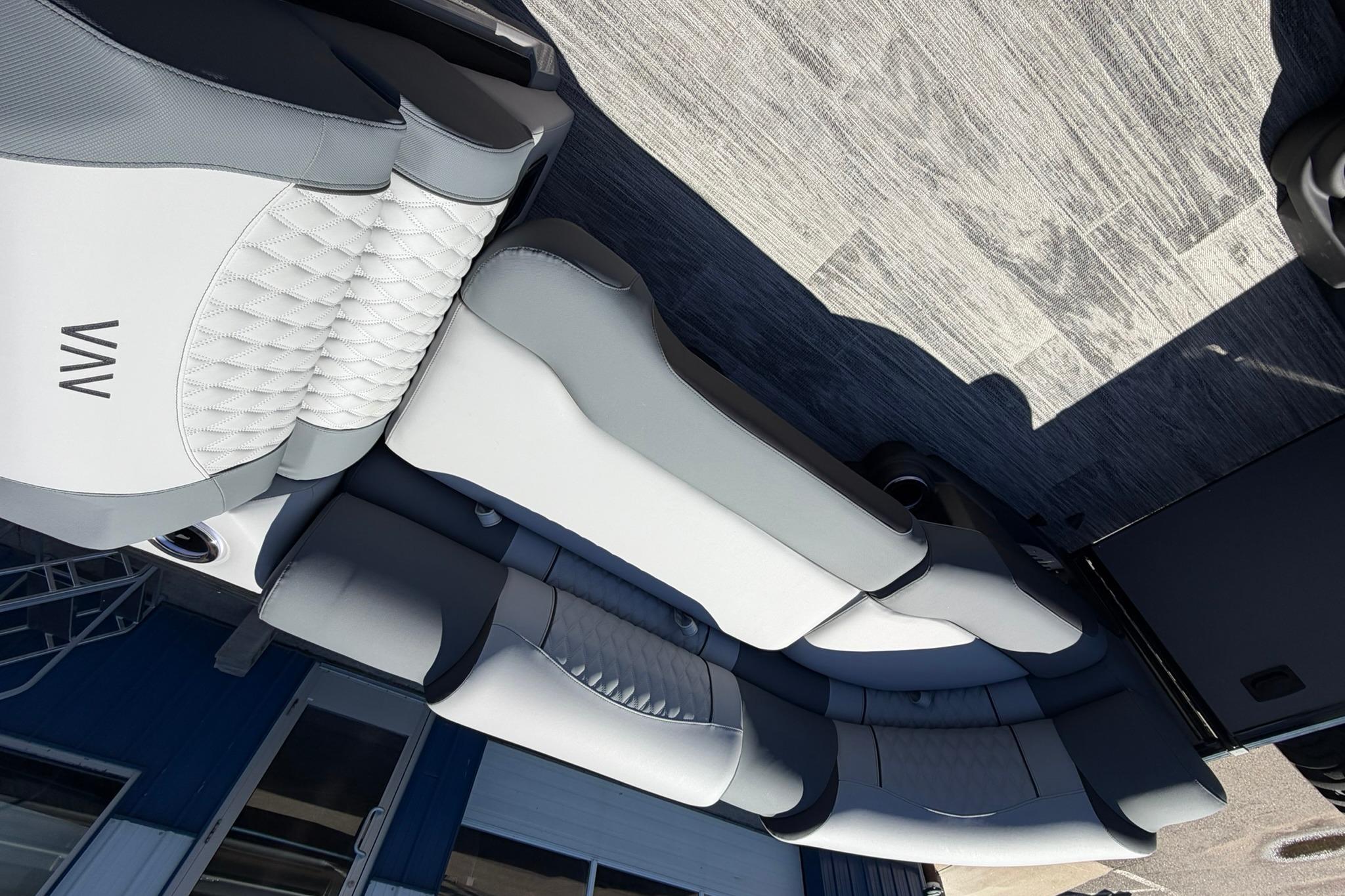 Luxurious seating on 2026 Avalon Excalibur LTD Quad Lounge boat, featuring elegant design and comfort.