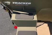 2026 Tracker Grizzly 1654 T Sportsman boat steps, outdoor setting.