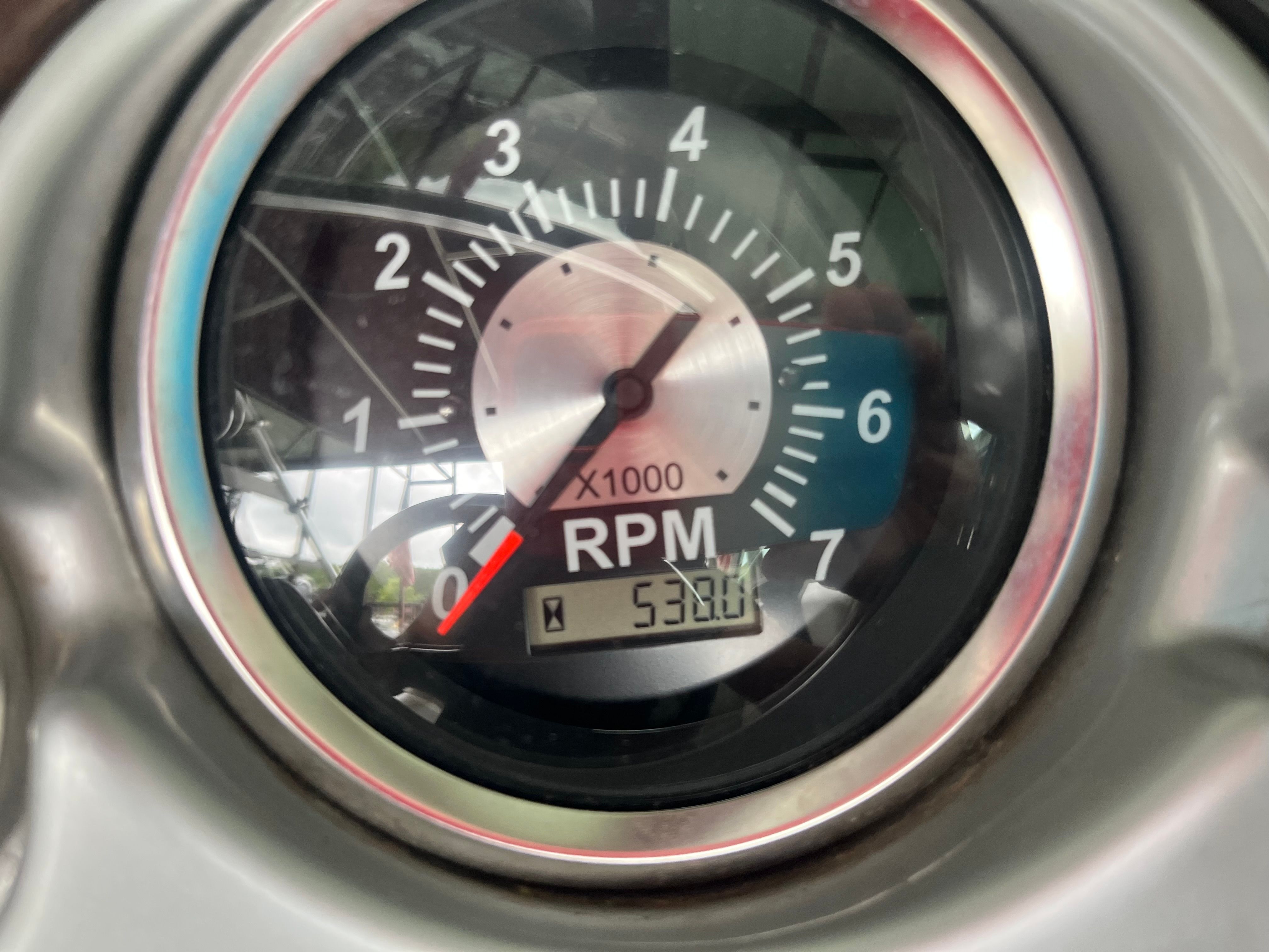 Close-up of a tachometer showing 5320 RPM.