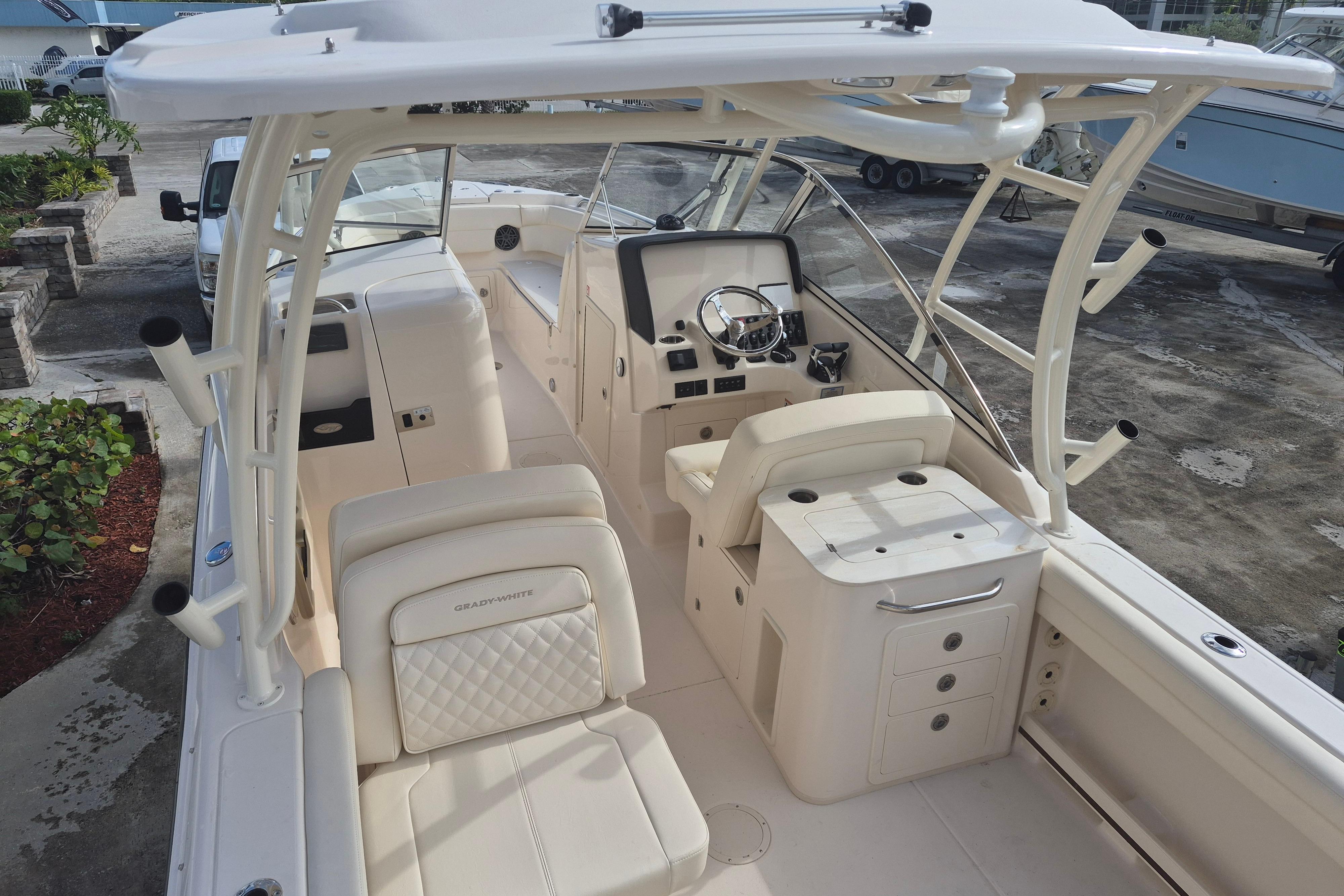 2026 Grady-White Freedom 275 boat interior with helm, seating, and storage compartments.