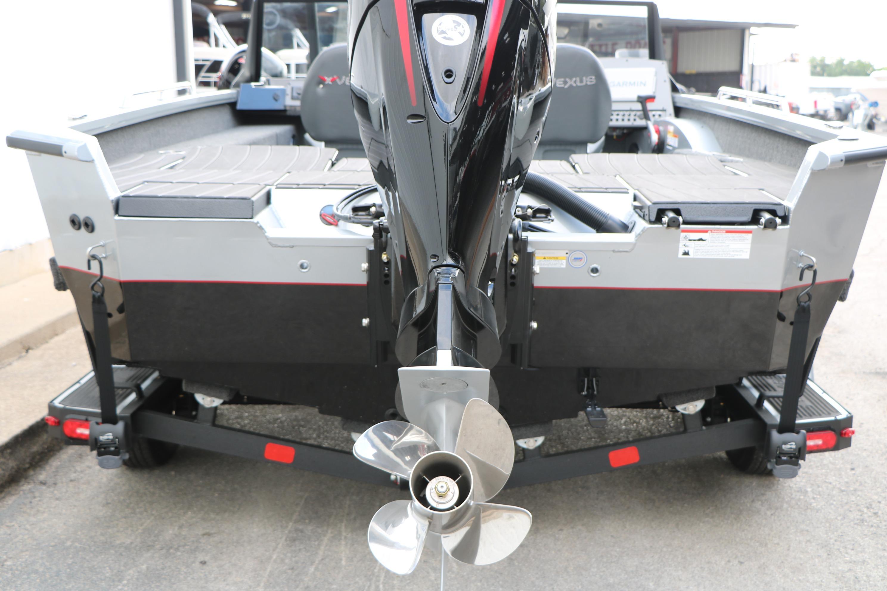 2026 Vexus ADX 190 boat rear view with outboard motor and propeller.