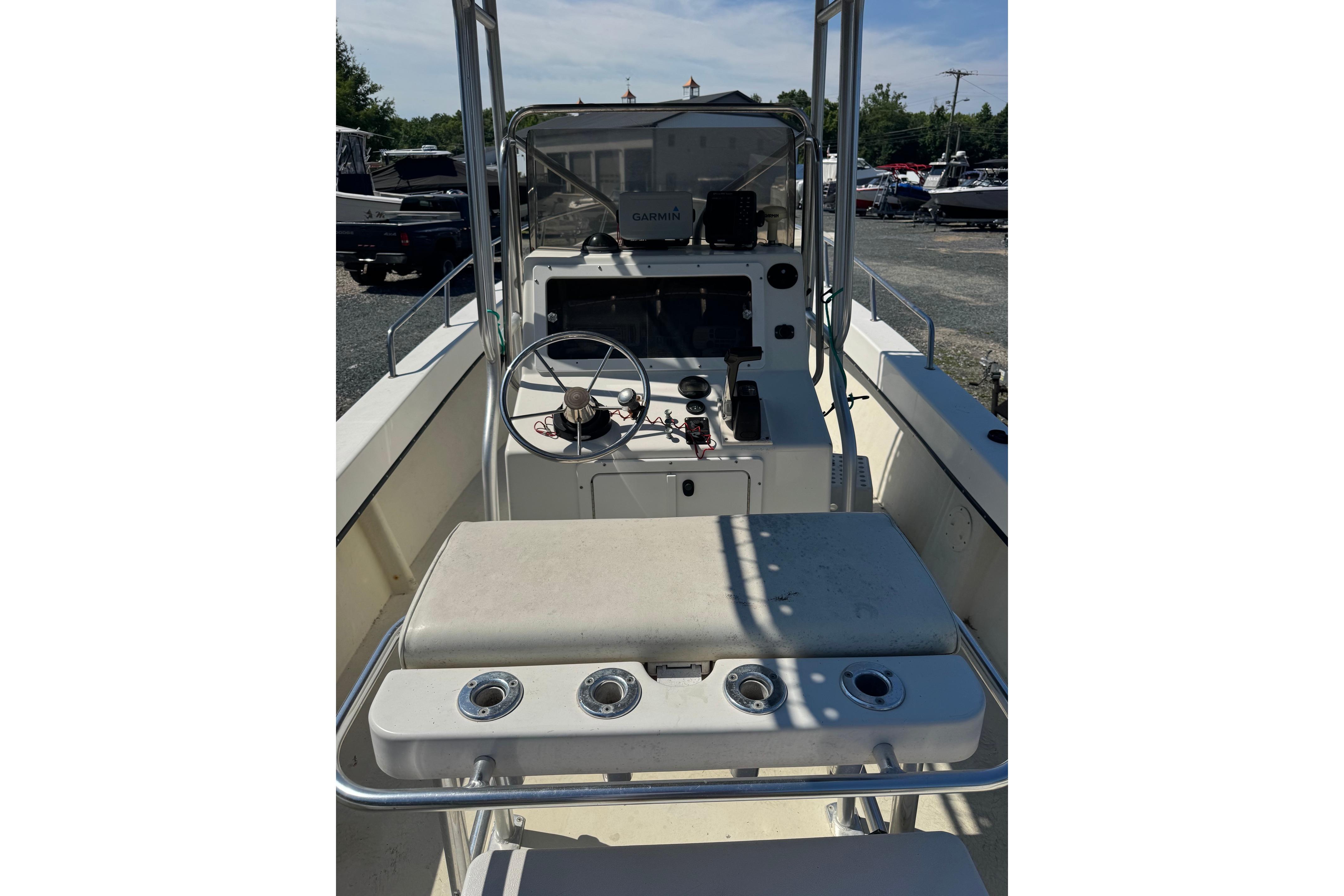 1997 Maycraft 23 boat interior with steering wheel and control panel.