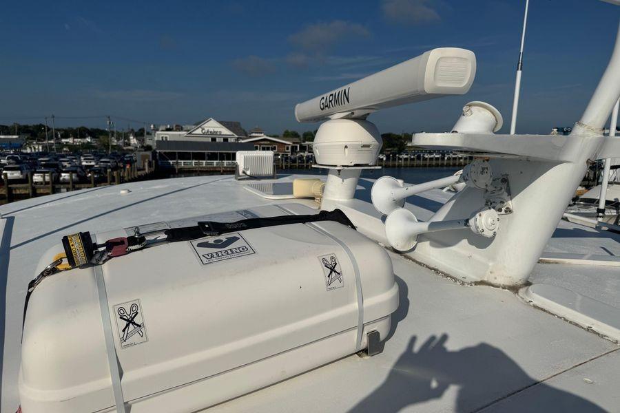 Rooftop of 2002 Viking 61 Enclosed Bridge with Garmin radar and equipment.