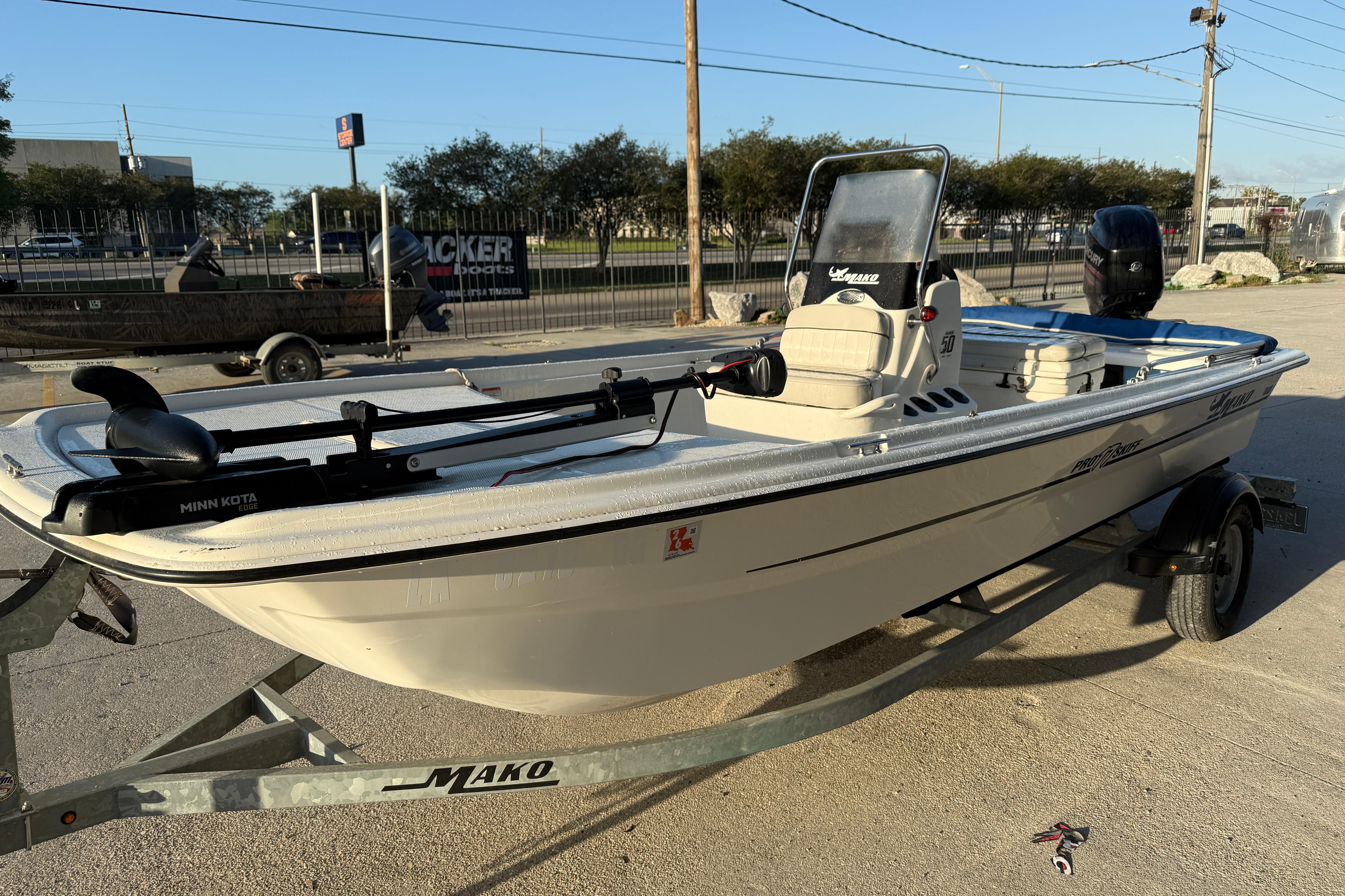 2017 Mako Pro Skiff 17 CC boat on trailer, equipped with Minn Kota motor.