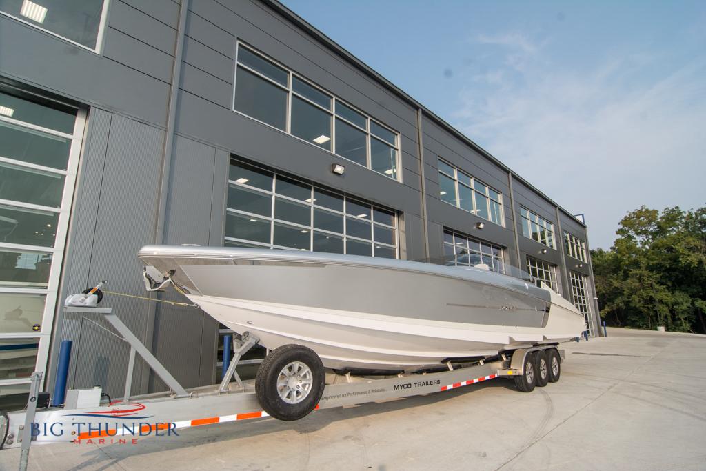 2019 Donzi 41 GT boat on trailer outside Big Thunder Marine building.