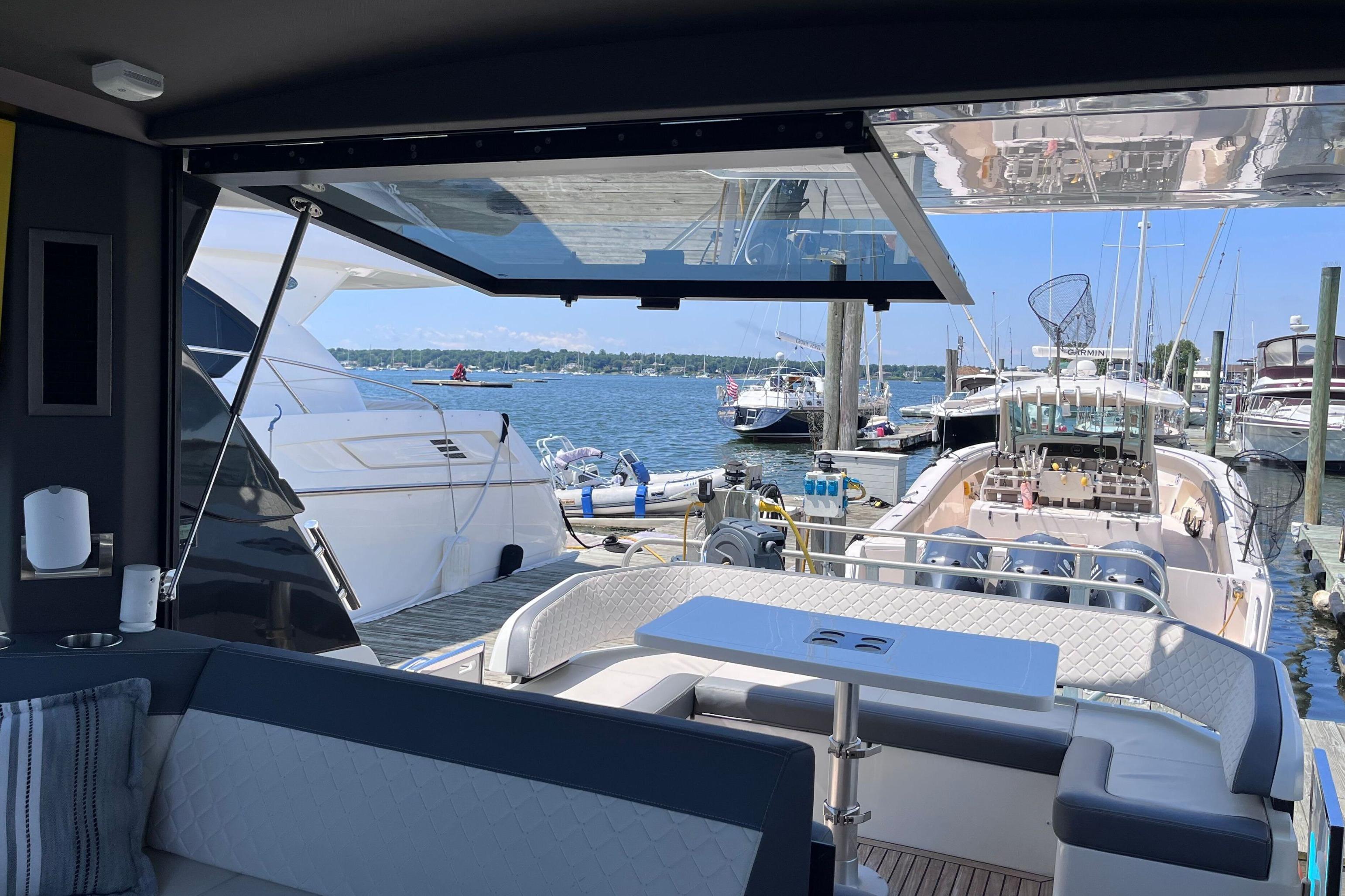 2024 Galeon 425 HTS yacht interior with open deck view at marina.