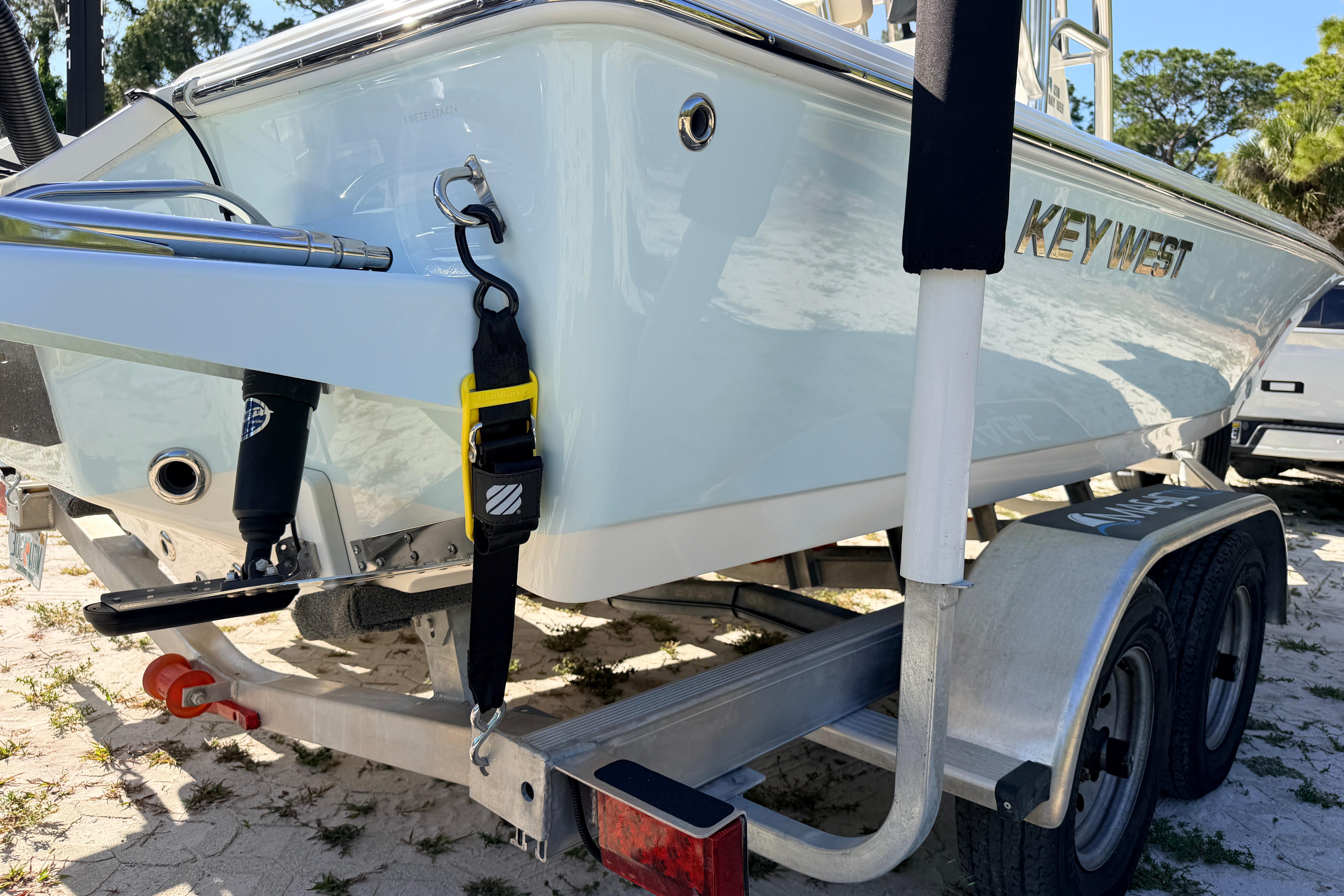 2024 Key West 210 Bay Reef boat on trailer, parked outdoors.