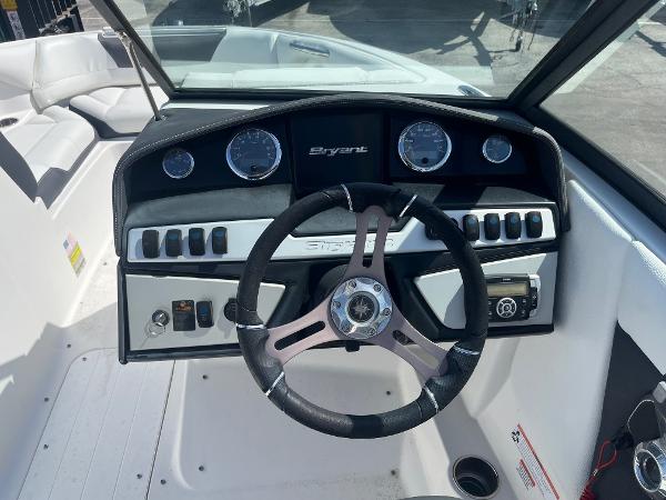 Steering wheel and dashboard of a 2018 Bryant Speranza boat, featuring gauges and controls.