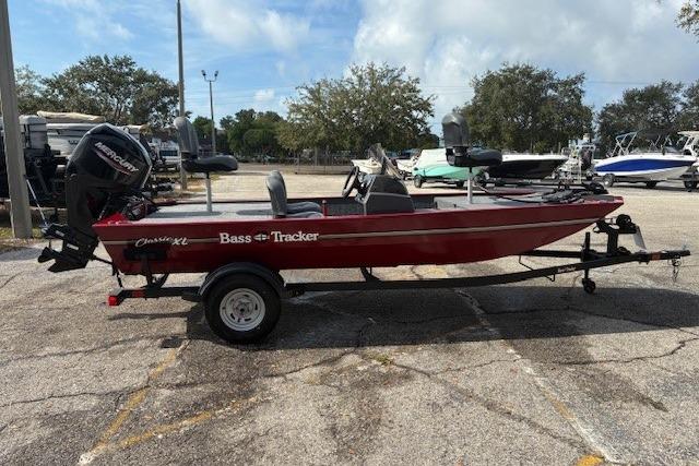 2025 Tracker Bass Tracker Classic XL boat on trailer in parking lot.