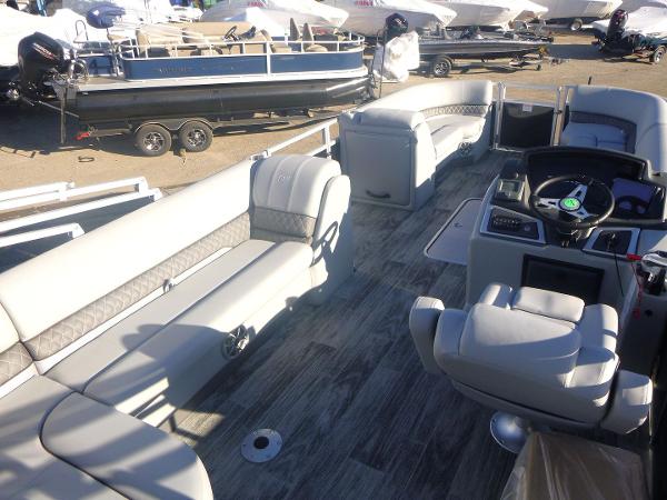 2024 Ranger Reata 223C pontoon boat interior with spacious seating and modern helm.