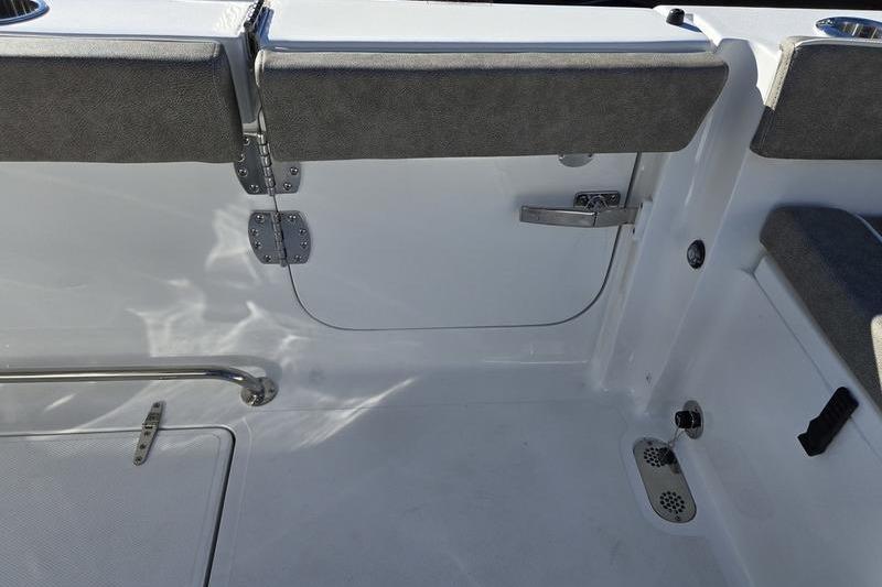 Interior view of 2026 Sea Hunt Ultra 275 Coffin Box boat, featuring seating and storage.