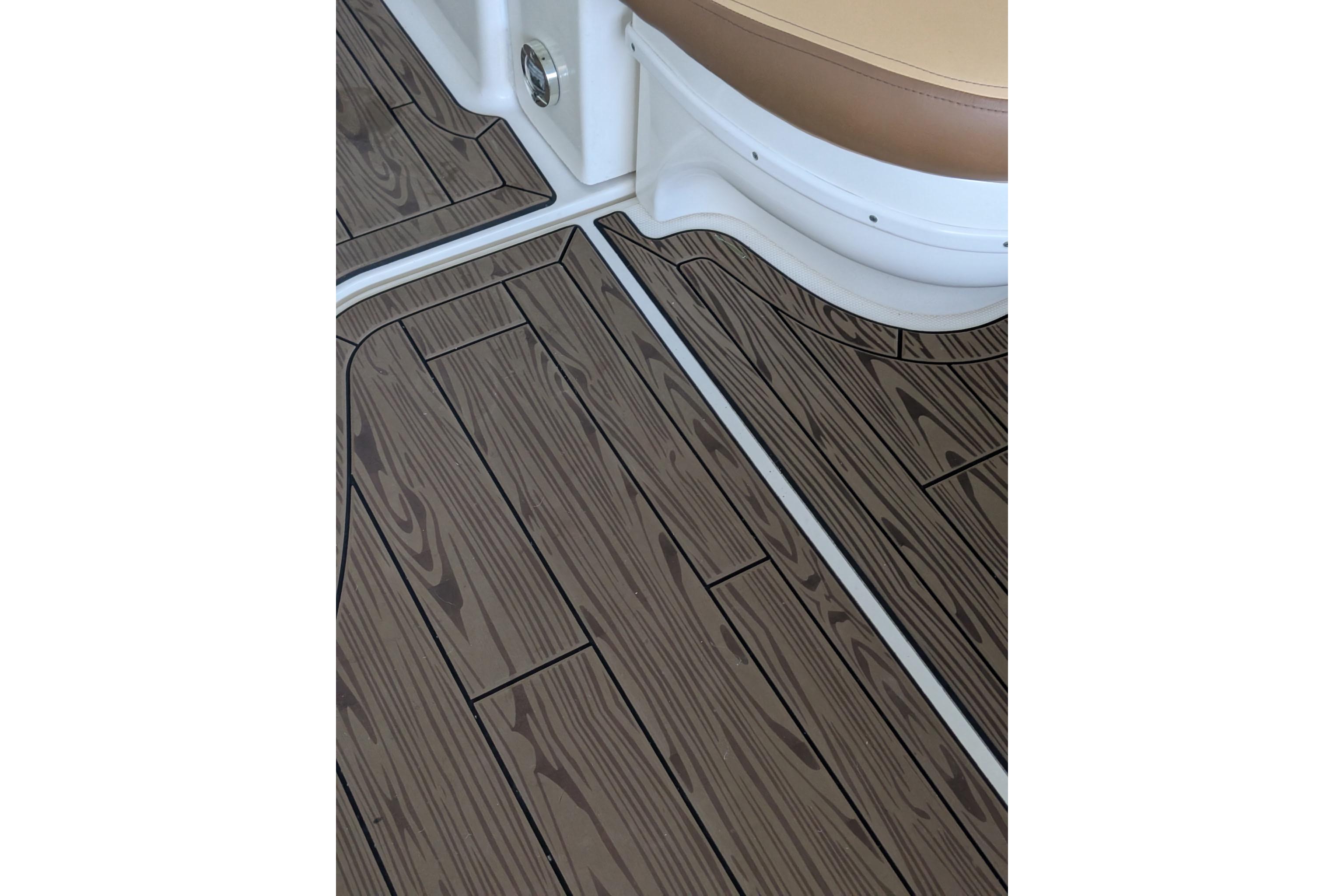 Teak-style flooring on a 2002 Sea Ray Sundancer 320 boat interior.