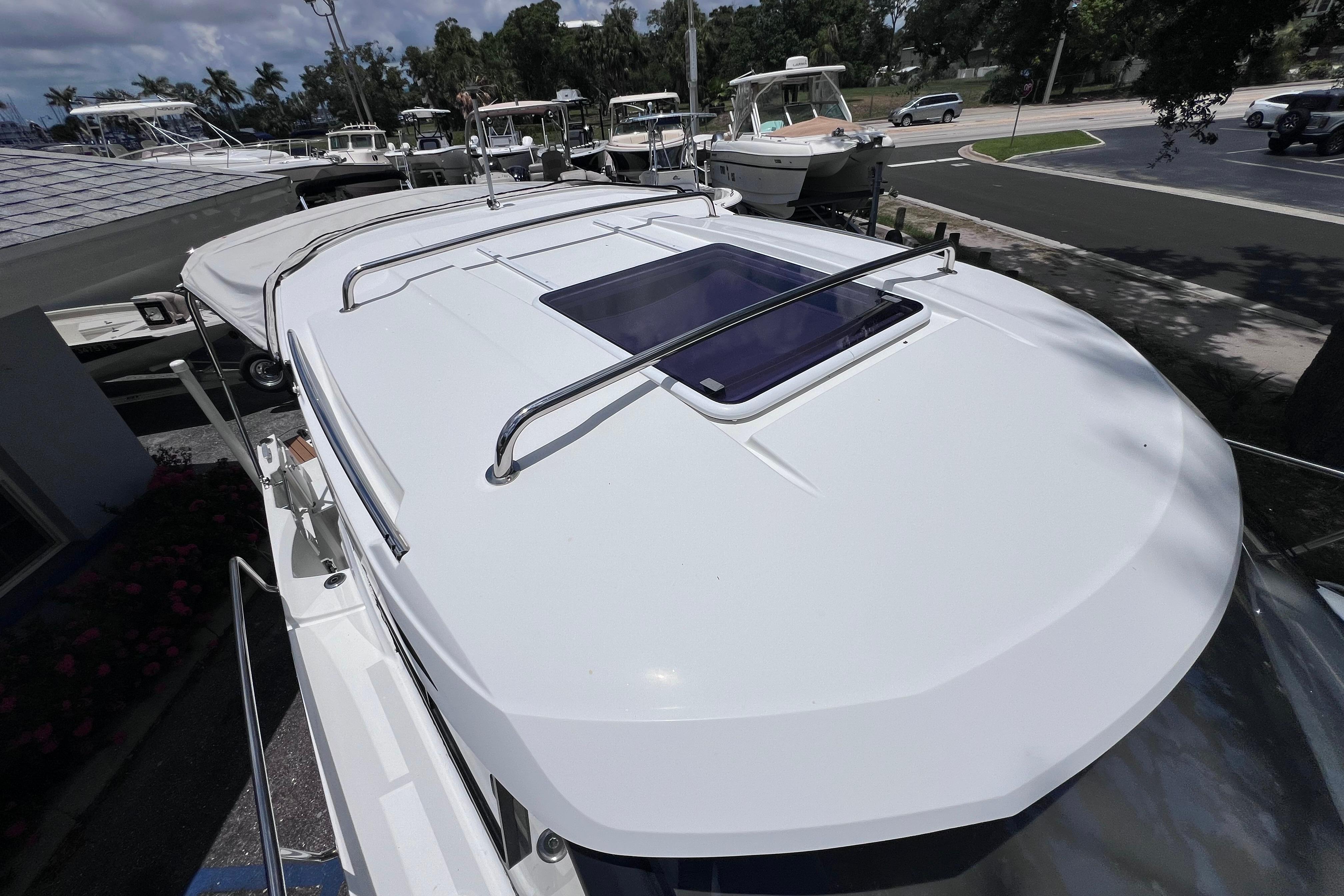 2021 Jeanneau NC Weekender 795 Series 2 boat roof with hatch and railing.