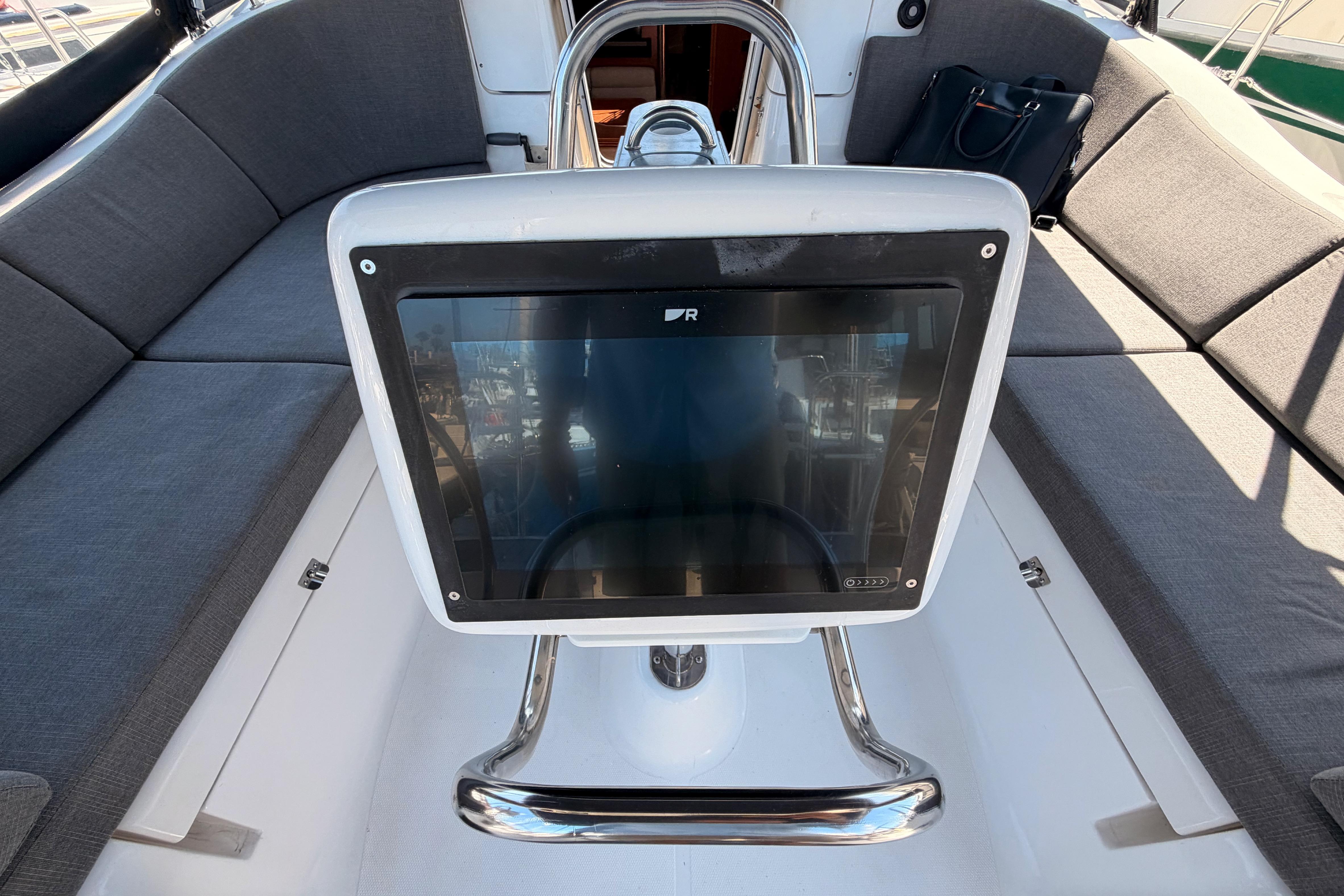 Cockpit of 2008 Hunter 45 Deck Salon with navigation display and cushioned seating.