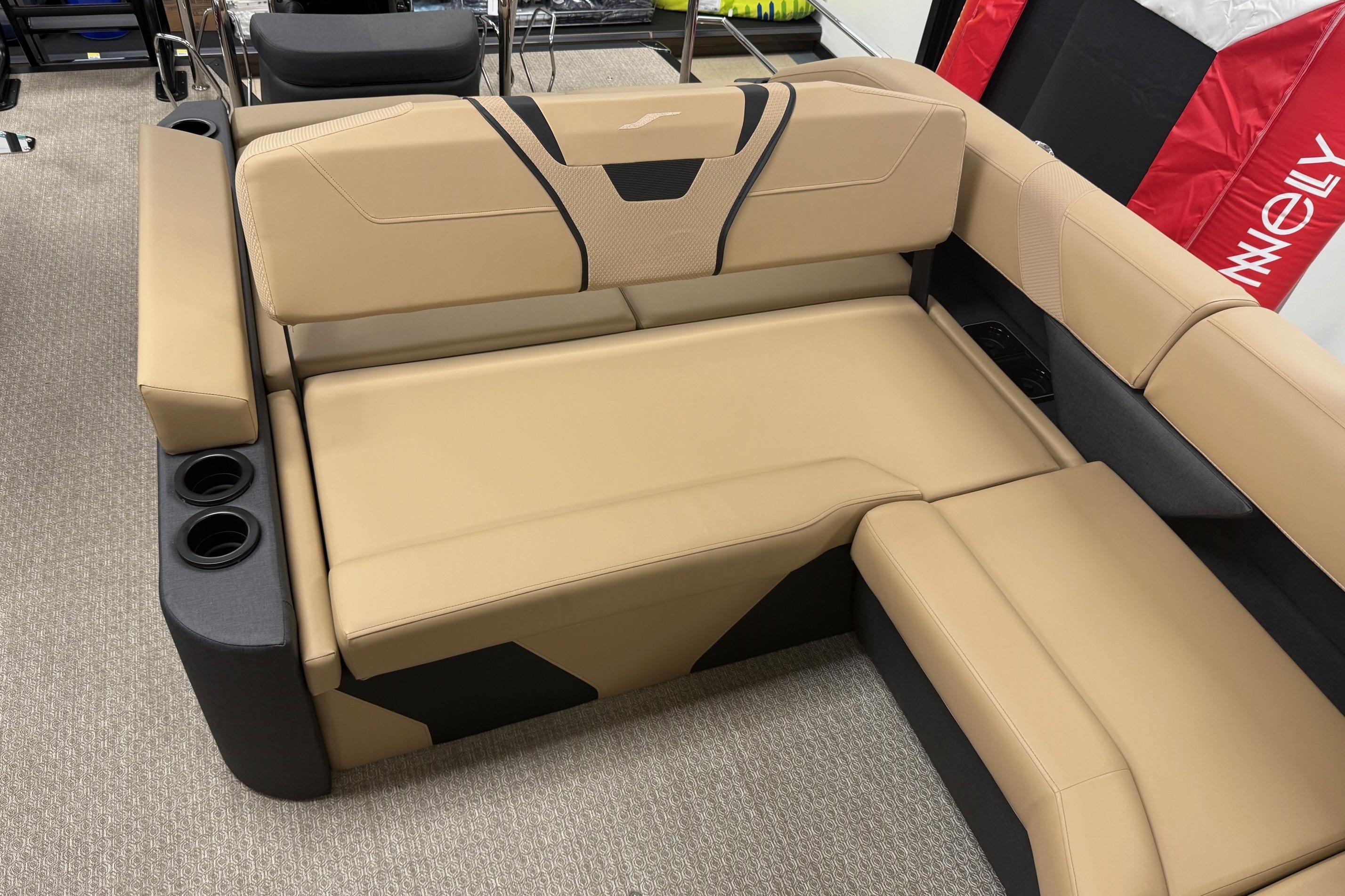 Luxurious beige seating on 2026 Evotti 725CS boat, featuring integrated cup holders.