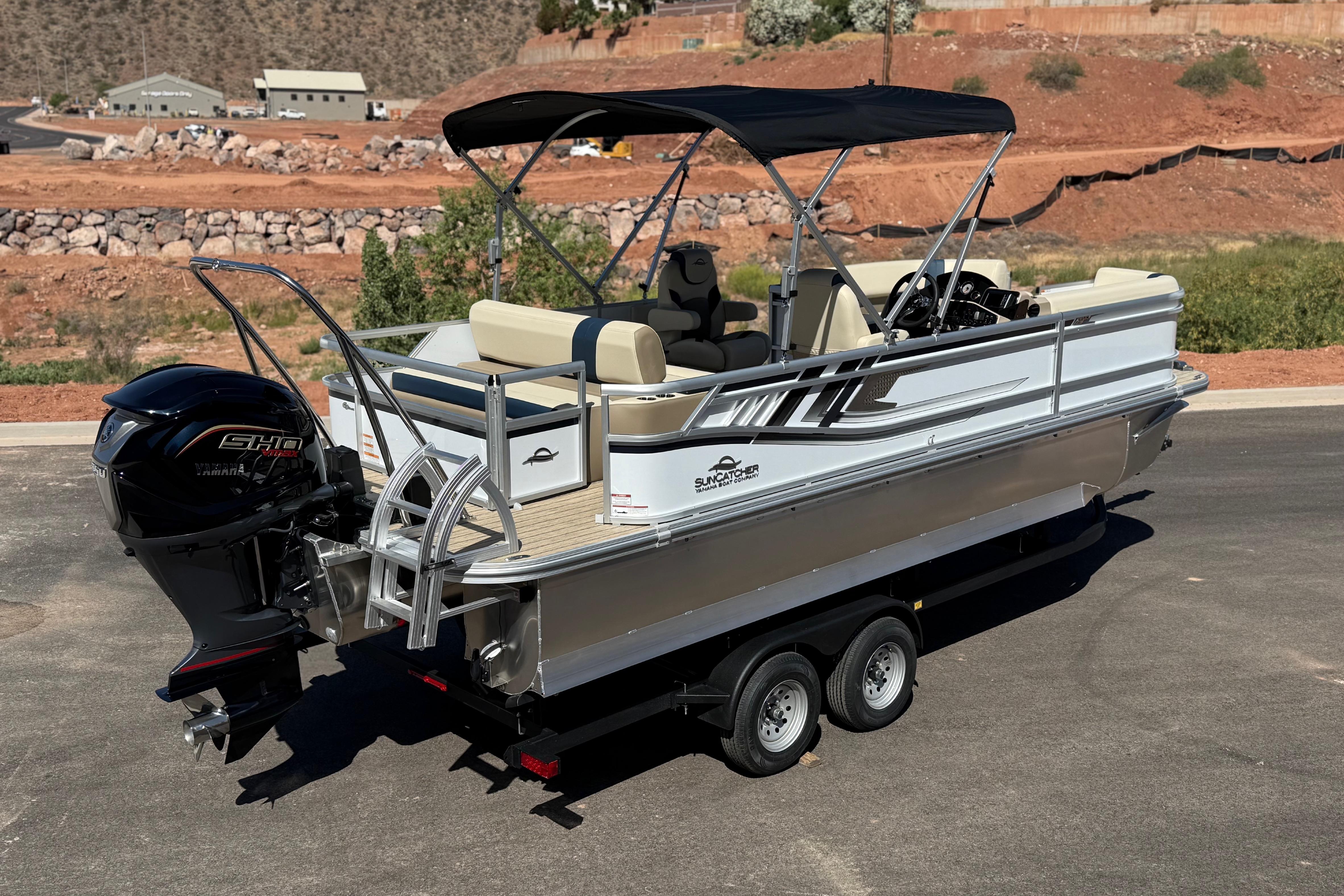 2026 SunCatcher Select 322SL pontoon boat with Yamaha engine on a trailer.