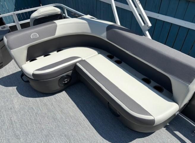 2026 Sun Tracker Bass Buggy 18 DLX pontoon boat seating with cup holders.